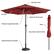 The image features a red umbrella with a solar panel on top. The umbrella has a button for the tilt function, and it is supported by eight powder-coated steel ribs. The umbrella also comes with a strap for easy crank opening and closing. However, the umbrella base is not included in the package.