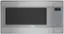 The timer clock on the microwave reads 0:02. The microwave is a Thermador brand and is designed for frozen cooking, vegetables, and defrosting. It has buttons for various cooking options, such as soften, melt, defrost, reheat, and more. The microwave is silver in color and has a clear glass door.