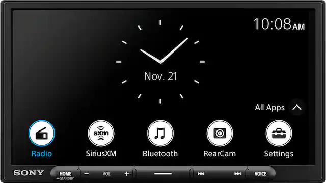 The text on the image reads: "10:08 AM Nov. 21 All Apps sxm Radio SiriusXM Bluetooth RearCam Settings SONY HOME STANDBY ee VOL + HH - VOICE."