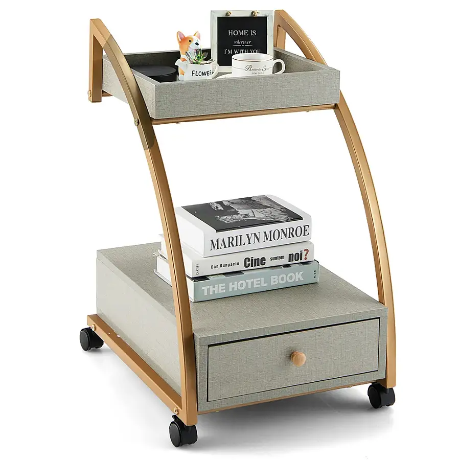 The text on the image reads: "Home is where the flower is." This is a quote from Marilyn Monroe. The cart is filled with books, including "Cine Noir" and "The Hotel Book."