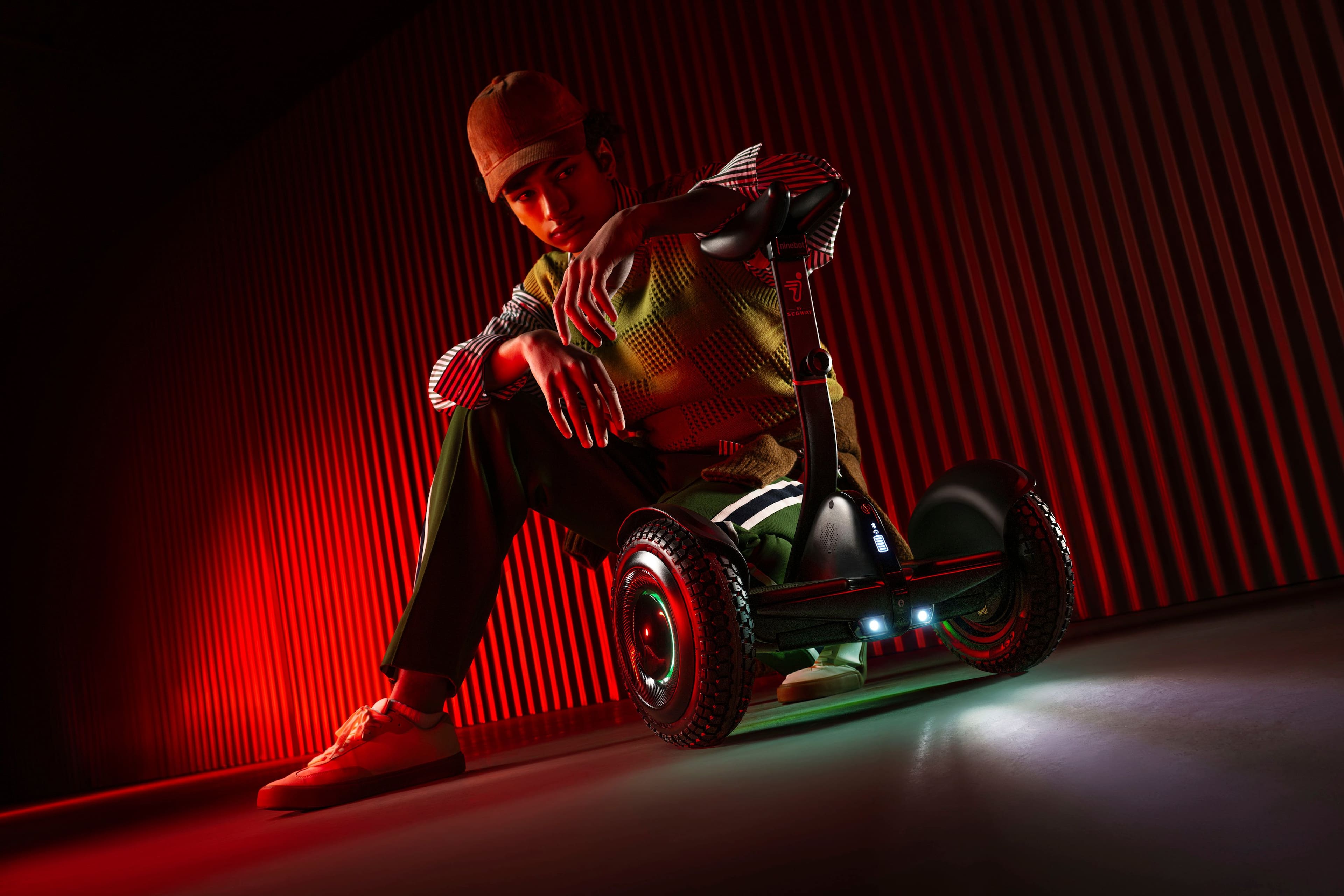 The text on the image reads "me ninebor - SECN III i ad." This text is likely a reference to a specific advertisement or promotional material related to the person sitting on the Segway.