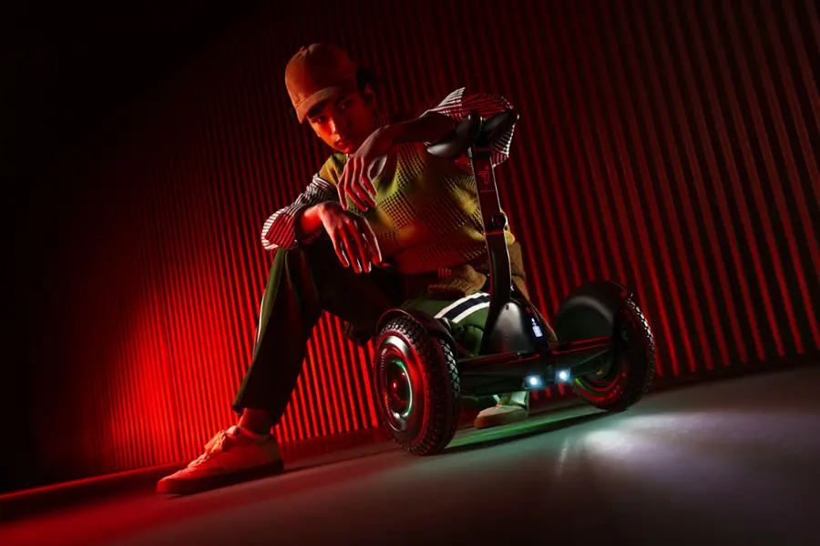 The text on the image reads "me ninebor - SECN III i ad." This text is likely a reference to a specific advertisement or promotional material related to the person sitting on the Segway.