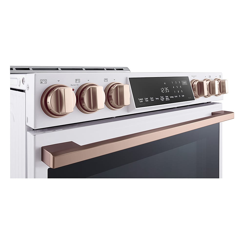 A 2 2 burner stove with a digital clock displaying the time of 12:35.