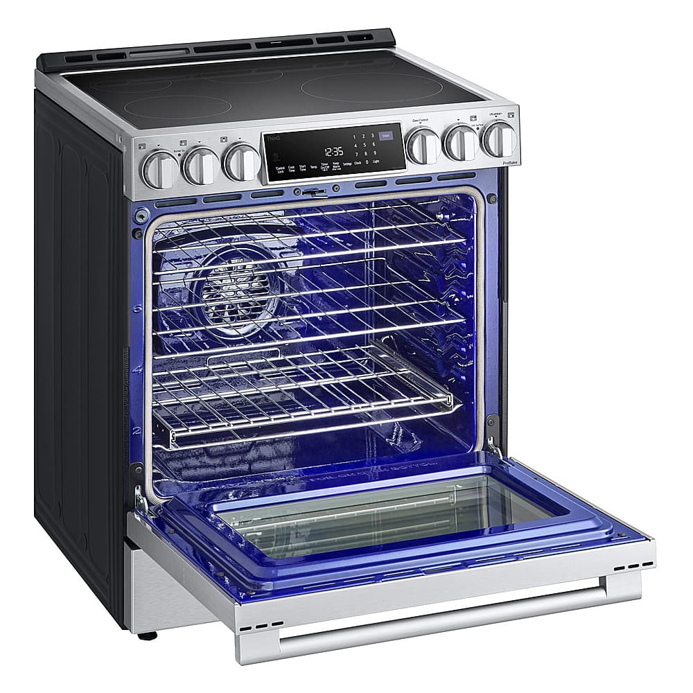 The oven is blue and silver in color. It has a digital display and a timer that shows the time and temperature. The oven has a clear glass door, and it is empty.