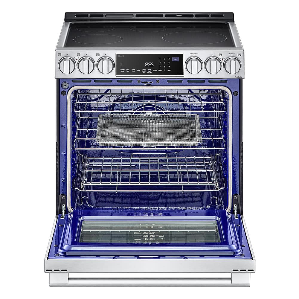 The image shows a blue and silver oven with the door open. The oven has a digital display and is equipped with a timer. The timer is set to 12:35, indicating that the oven is currently in use. The oven is likely being used for cooking or baking, as it is a common appliance found in kitchens.