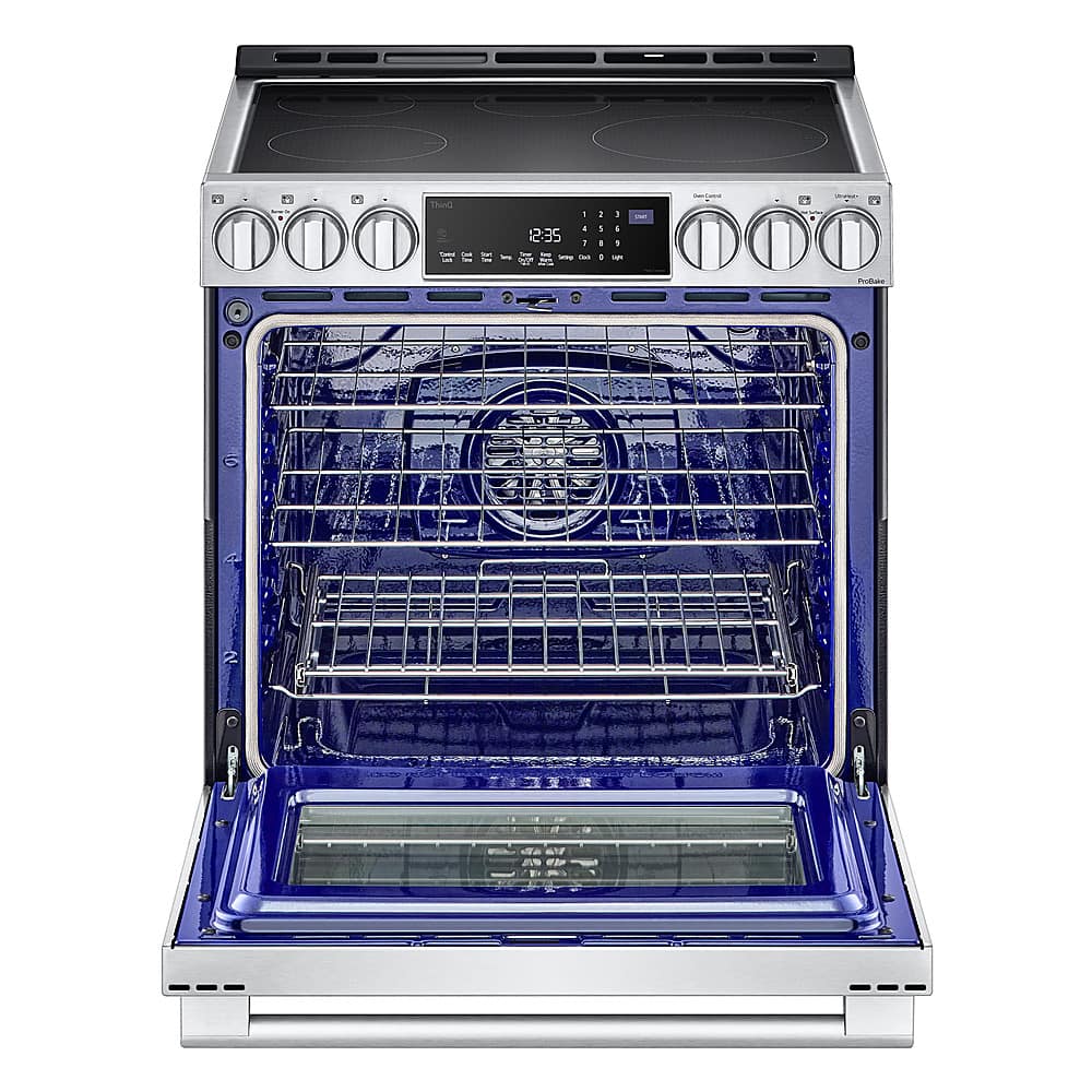 The oven is blue and silver. It has a digital display and a timer. The oven is empty and open.