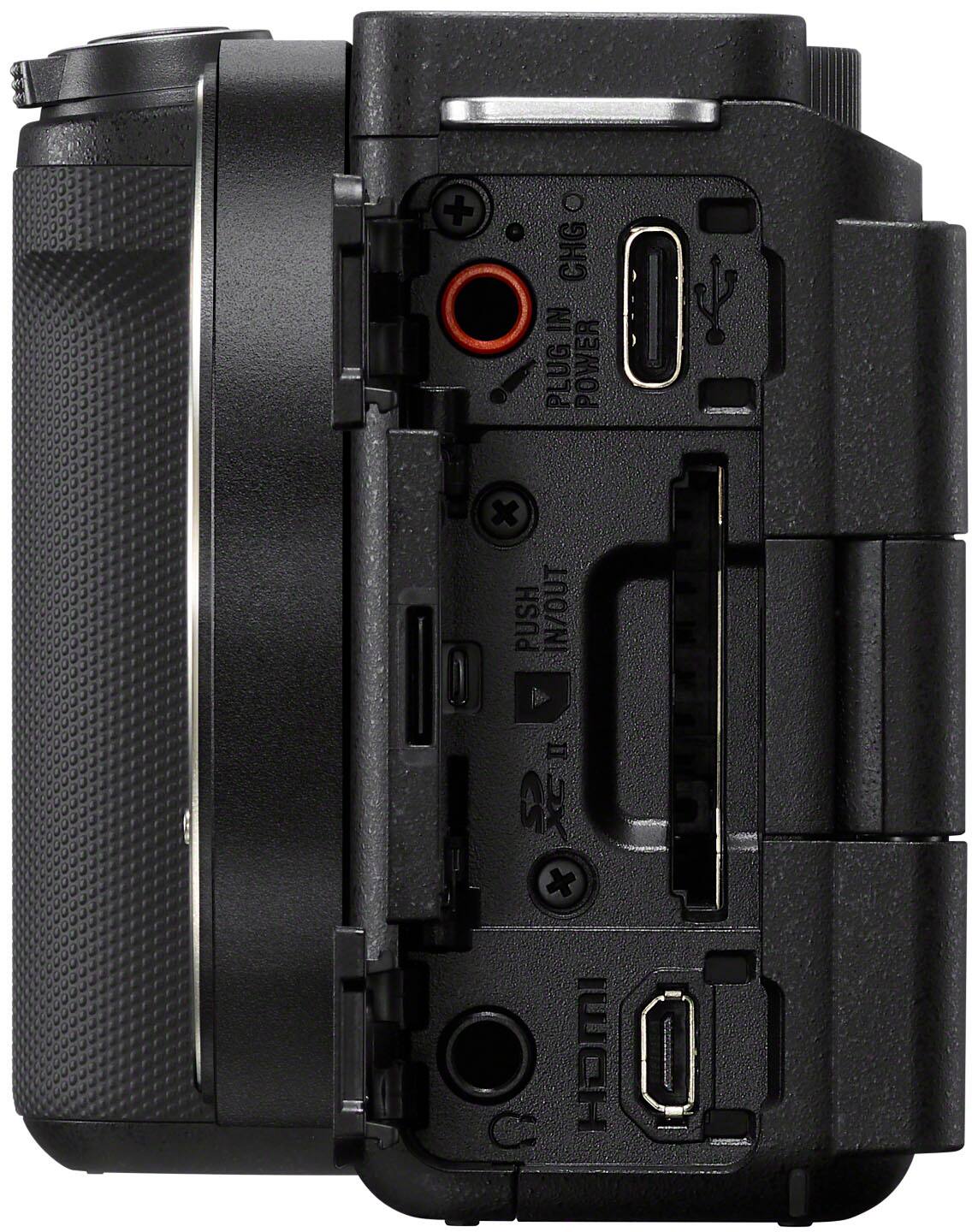The image features a camera with a black case and a plug in the back. The camera is designed for plug-in power, and it has a push in/out button. The camera is made by HOMI.