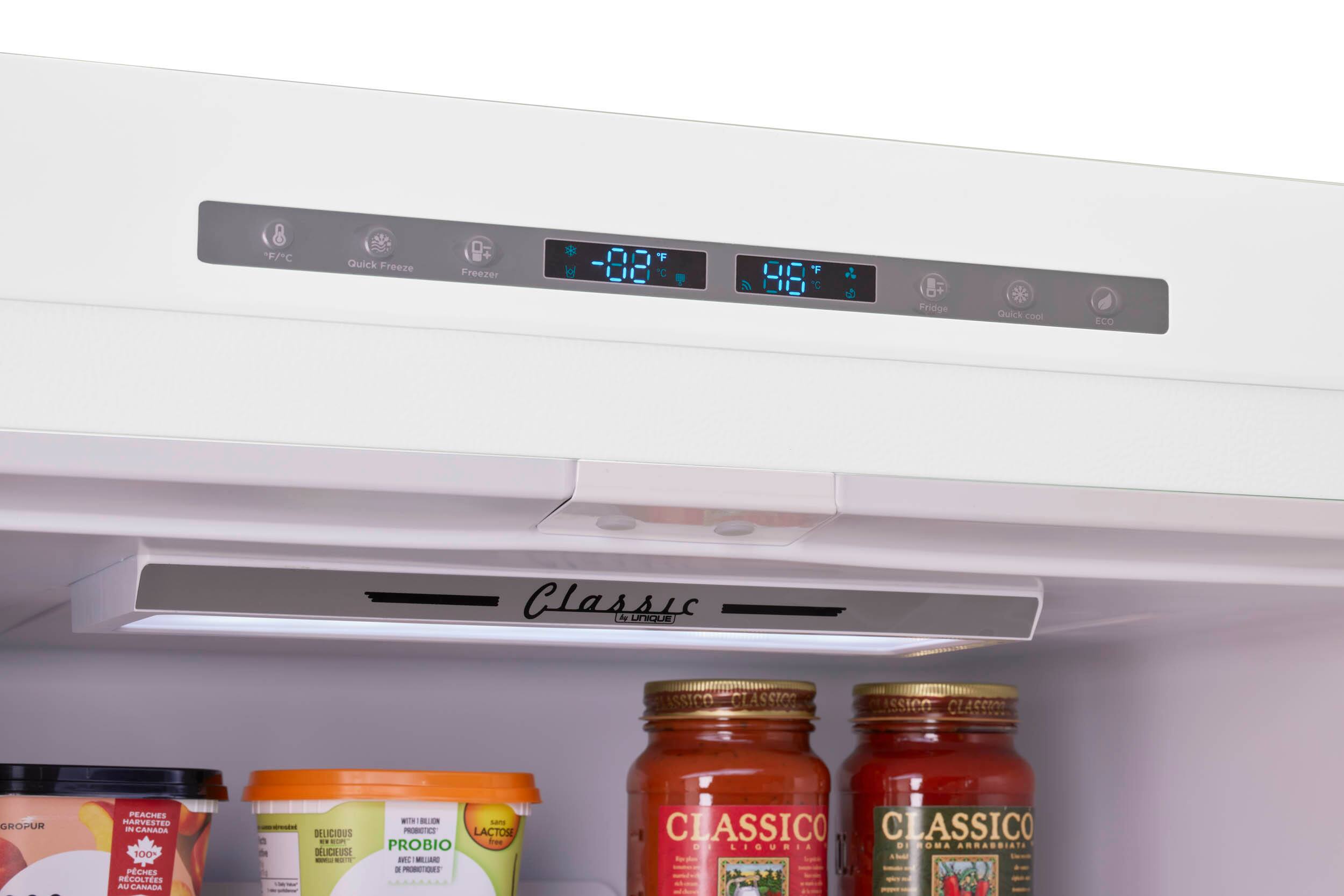 The text on the image reads:

F/C Quick Freeze  Freezer 'F C *F  Fridge sta Quick cool ECO Classic dy UNIQUe SUSSICO CLASSICO ISSICO CLASSICO GROFUR  ee PEACHES HARVESTED I CANADA 100 PCHES RCOLTES AU CANADA - DELICIOUS DEL i . P DLICIEUSE - - a - BLO s PROSCTES LACTOSE PROBIO frae IC MELIARD a PTOR CLASSICO C CLASSICO OO LIGUMIA DI DEPOMA ARRADOIATE 1