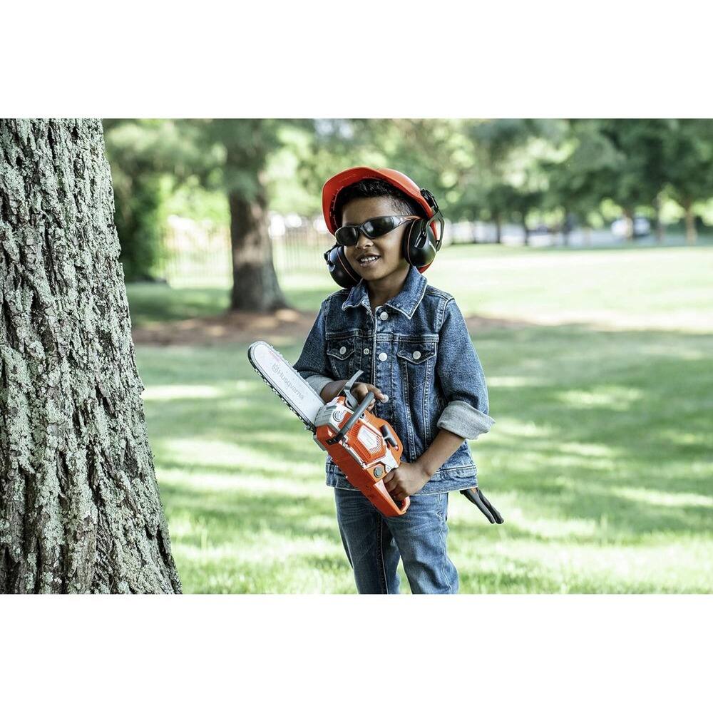 Left. Husqvarna - 550XP Toy Chainsaw and PPE Kit.