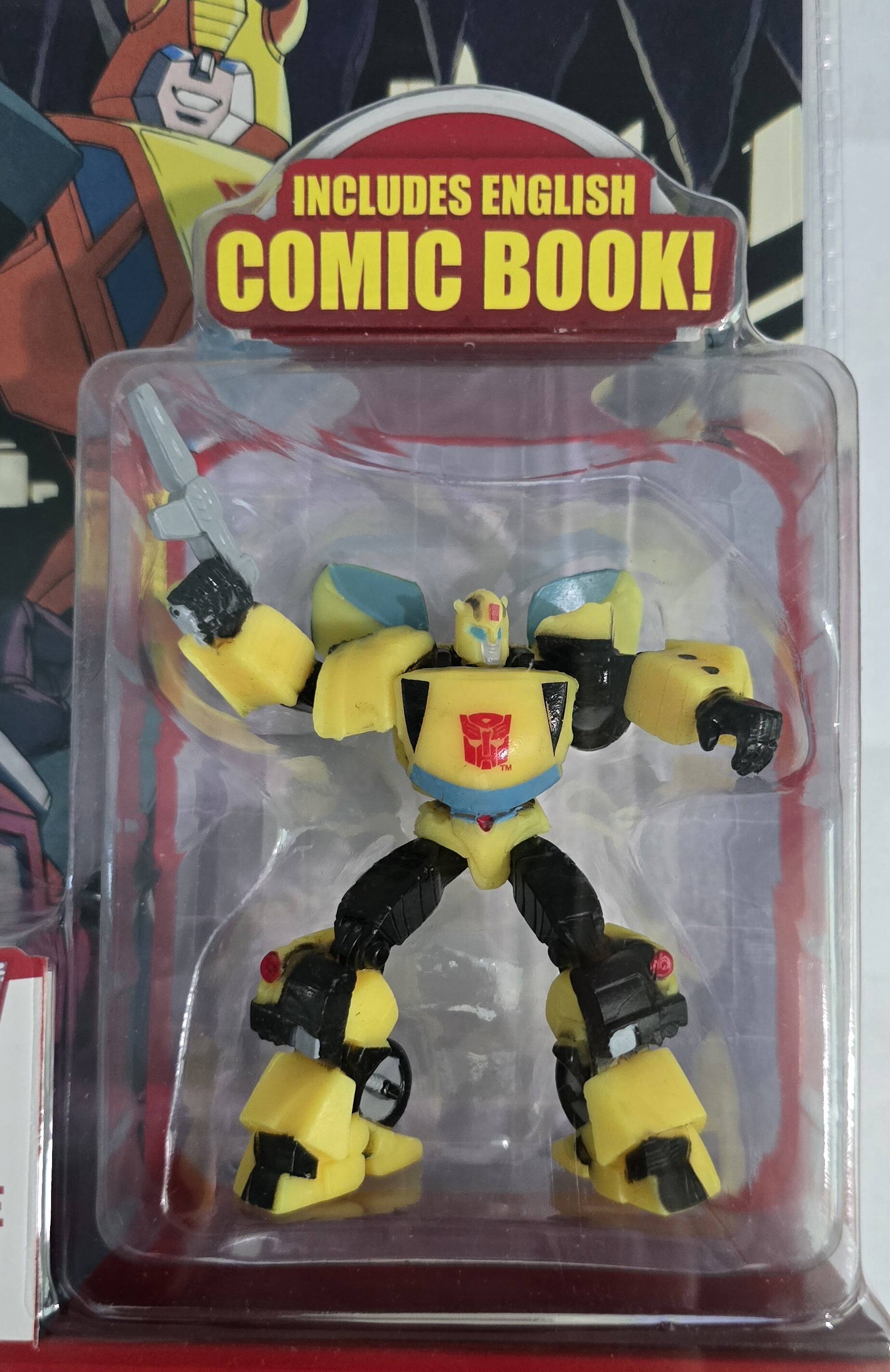 The text on the image reads: "INCLUDES ENGLISH COMIC BOOK!"