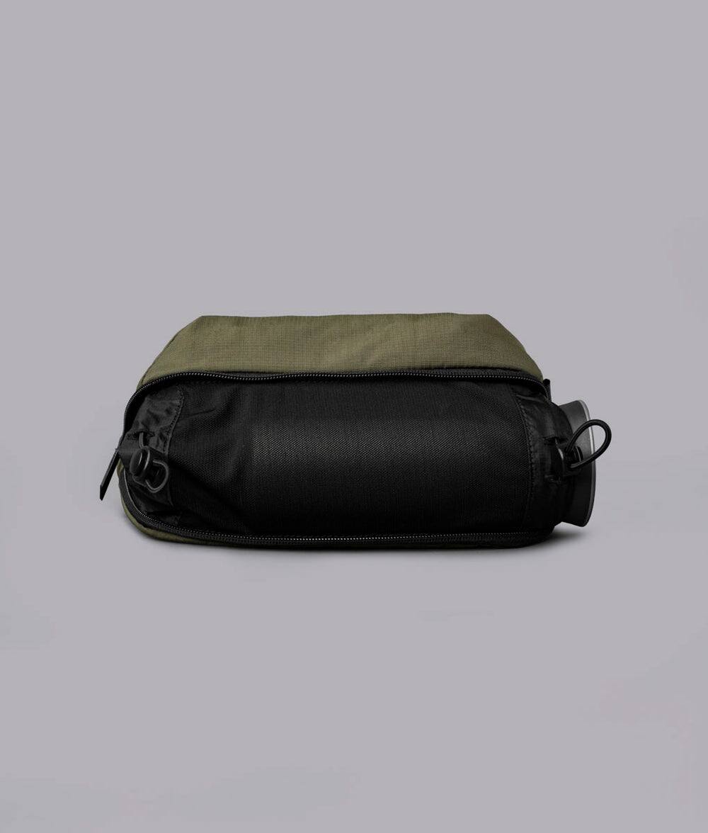 Alt View 1. ALPAKA - Flight Sling Pro 2.5L Sling Bag Crossbody Bag for Men, Bottle/Umbrella Sleeve, Fits 8.3" Tablet, YKK AquaGuard - Green Axoflux 400D Ripstop Nylon.