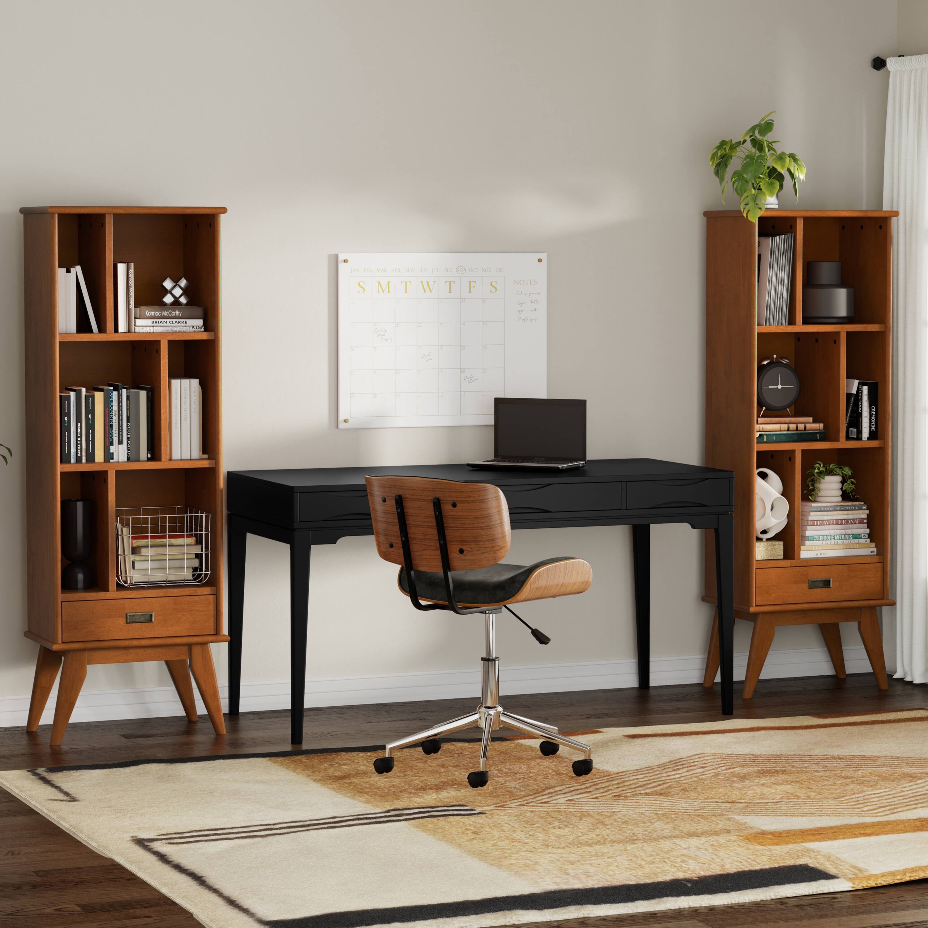 Sure, here is the corrected and grouped text from the image:

**Left Bookshelf:**
- "Kamikaze Caribou"
- "Brian Chippendale"

**Whiteboard:**
- "S M T W T F S"
- "NOTES"
- "1/1/2023"
- "1/2/2023"
- "1/3/2023"
- "1/4/2023"
- "1/5/2023"
- "1/6/2023"
- "1/7/2023"
- "1/8/2023"
- "1/9/2023"
- "1/10/2023"
- "1/11/2023"
- "1/12/2023"
- "1/13/2023"
- "1/14/2023"
- "1/15/2023"
- "1/16/2023"
- "1/17/2023"
- "1/1