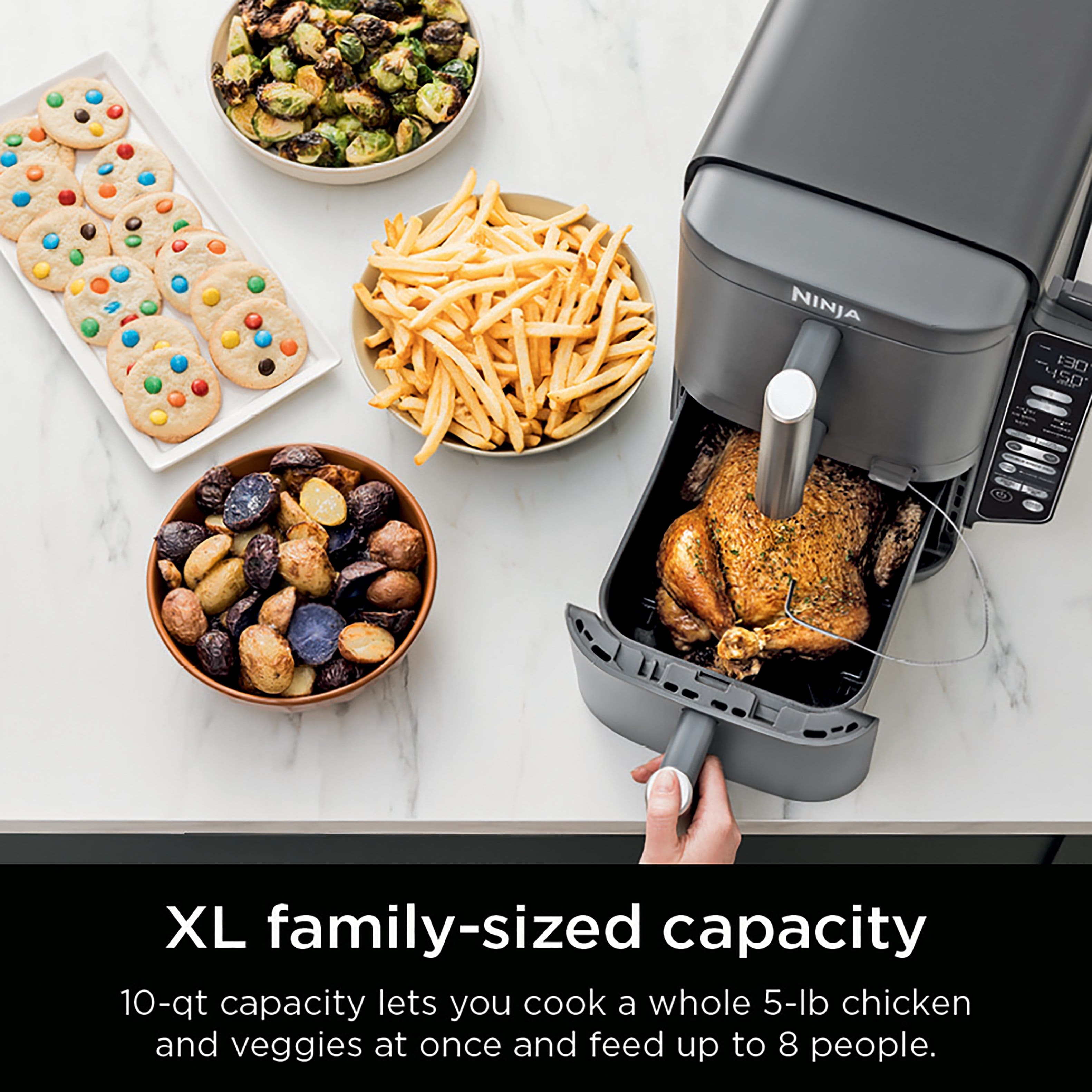The text on the image reads: "NINJA 130 4SD XL family-sized capacity 10-qt capacity lets you cook a whole 5-lb chicken and veggies at once and feed up to 8 people."