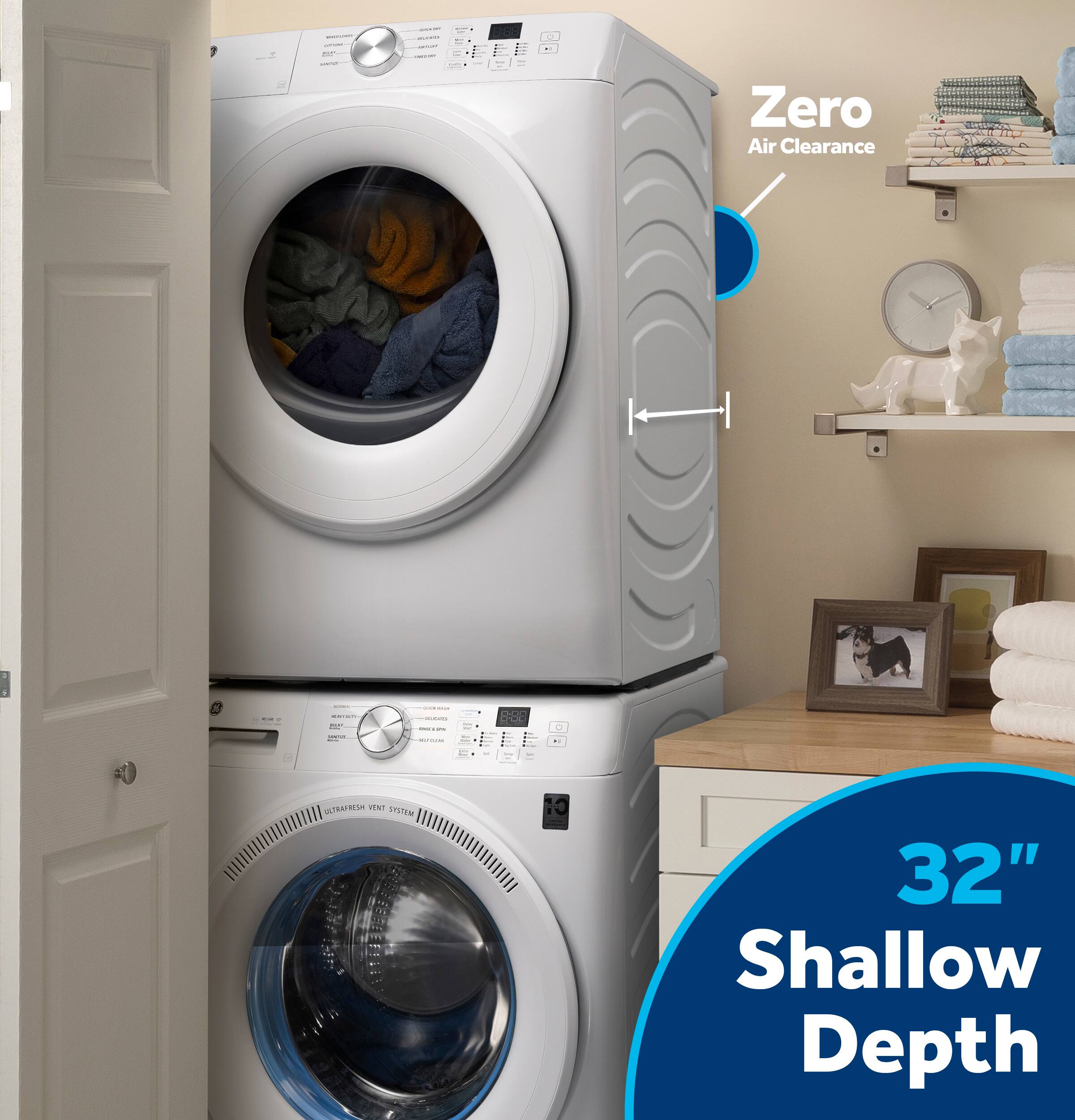 The image features a laundry room with two washing machines, one of which is a zero air clearance machine. The machines are placed in a cabinet with a shelf above them. The image also includes a clock on the wall and a dog picture on the shelf.