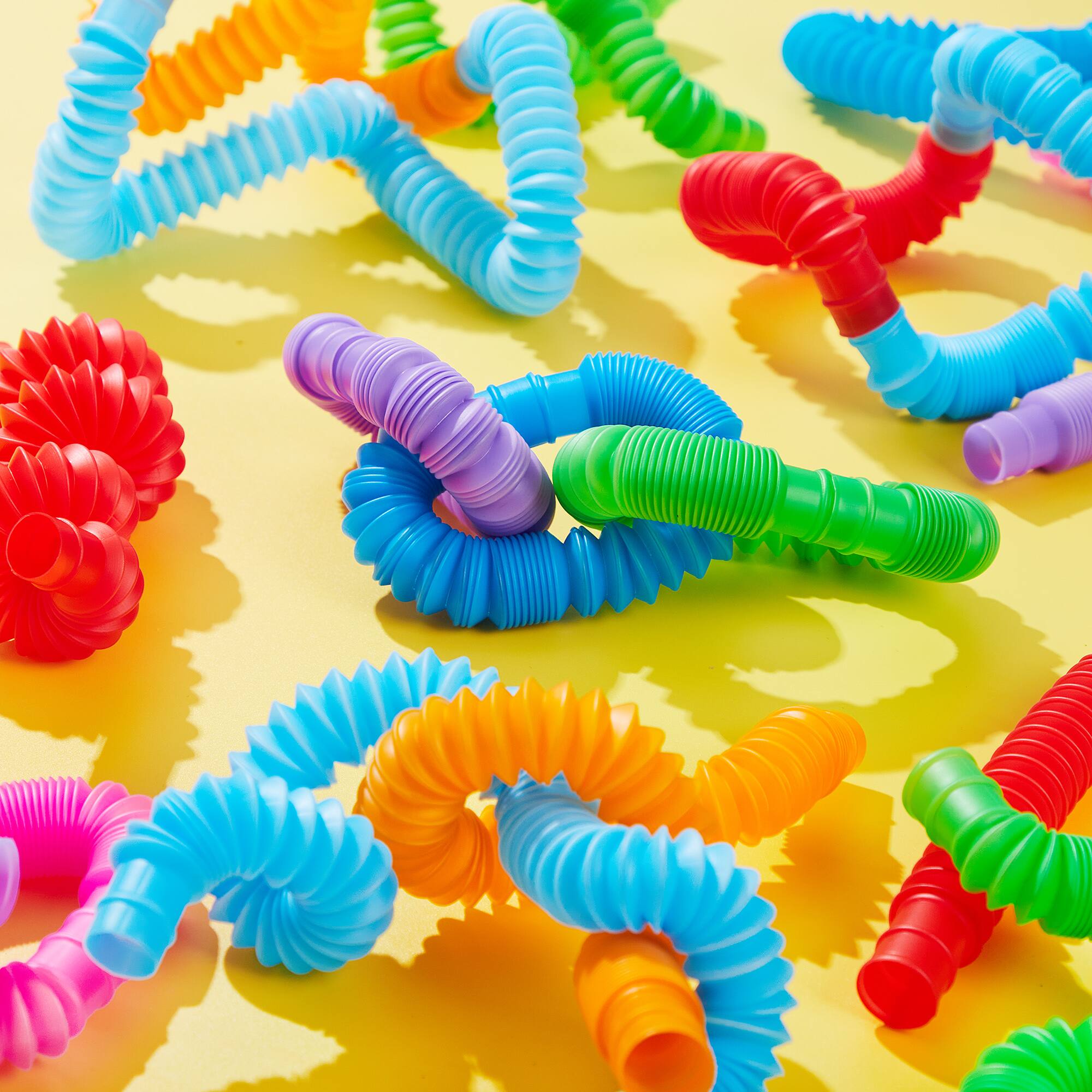 Angle. Joyfy - 36 Pack Pop Tubes Party Favors Fidget Tubes for Kids 9 Colors Connectable & Extendable Stress Relief Sensory Toys - colorful.