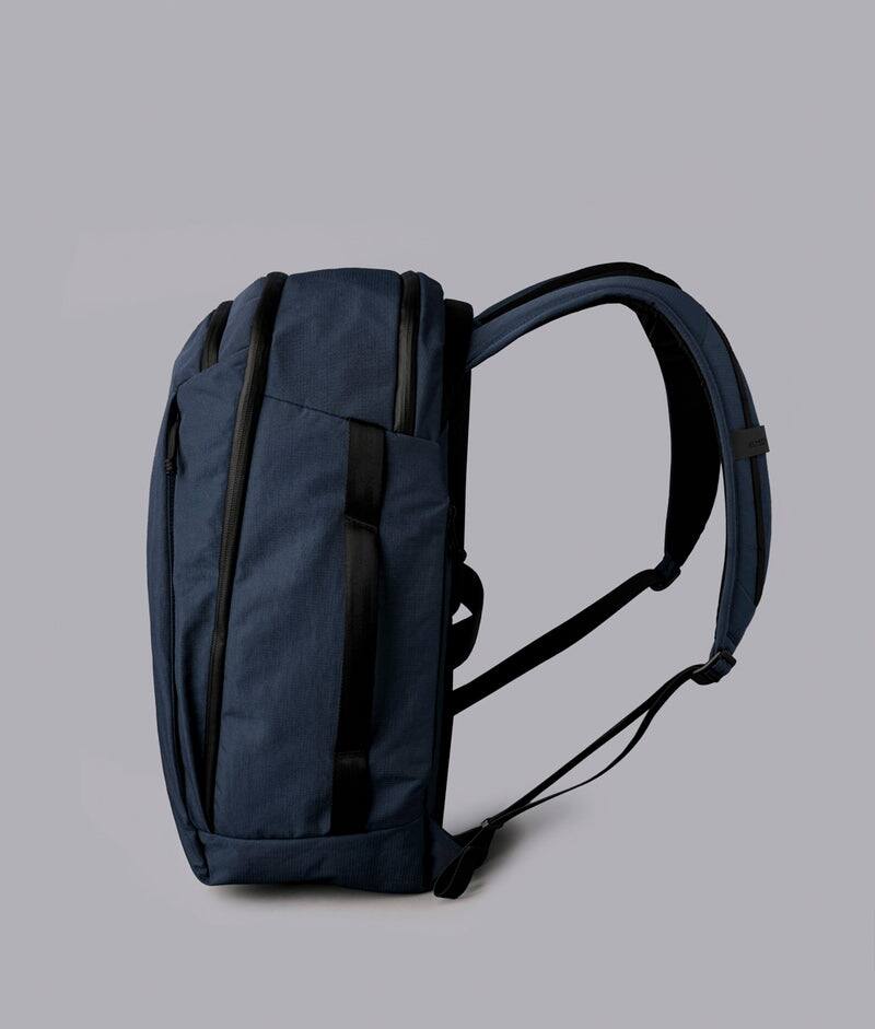 Left. ALPAKA - Traverse Backpack Laptop Backpack for Men, Backpack with Laptop Compartment (16"), Clamshell Travel Pack, Bottle Sleeve - Moonlight Blue Axoflux 400D Ripstop Nylon.