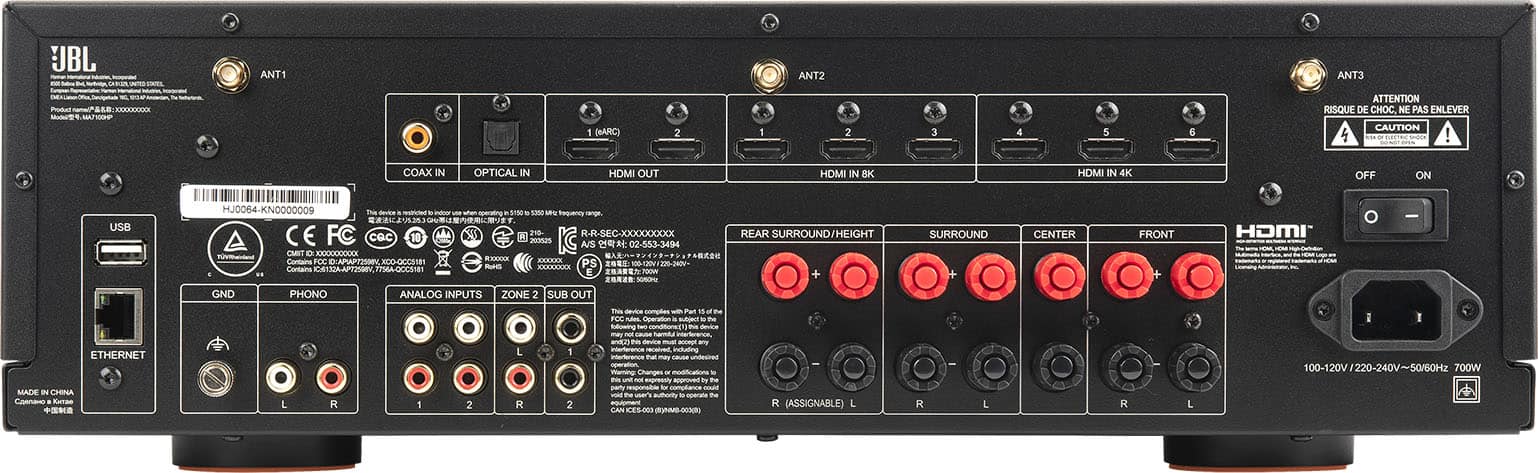 The text on the image reads:
"JBL - 1 ANTI ANT2 ANT3 PARTY N - I (eARC) 2 1 2 3 4 5 6 ATTENTION RISQUE DE CHOC NE PAS ENLEVER CAUTION L. soca! COAX IN OPTICAL IN HDMI OUT HDMI IN 4K OFF ON USB MJ0064-KNOO0OOO9 Th. - - - sme ME Requently caro CE FC %0 210 R-R-SEC-XXXXXX0XXX cec 10 LA ntos A/S 02-543-3494 OMIT 1000XXXXXX -o -X Contains TO0 CCAPAPT2SN XOO XO0-00C ARRALA PS 18 Contains OA Cs8 - CEERELCE E GND PHONO ANALOG INPUTS ZONE 2 SUB OUT REAR SURROUND/HEIGHT + SURROUND CENTER FRONT + HDMI I - R n - - ETHERNET MADE IN CHINA Cannano Rutao L R 2 L R 1 2 This complies - Pun FCC Operattion . - te Sallowing - - spressty - m te pa responsibile d CEA - ne uars sutuuity - te amant KES0 -hio- R (ASSIGNABLE) L R L R L I I 100-120V 220-240 50/50Hz 700W"
The text is a combination of different languages, including English and French. It appears to be a description or instructions for a device, possibly a sound system or a home theater system. The text mentions various features such as HDMI input and output, analog inputs, and Ethernet connectivity. It also includes a warning about the risk of electric shock and cautions the user not to remove any parts.