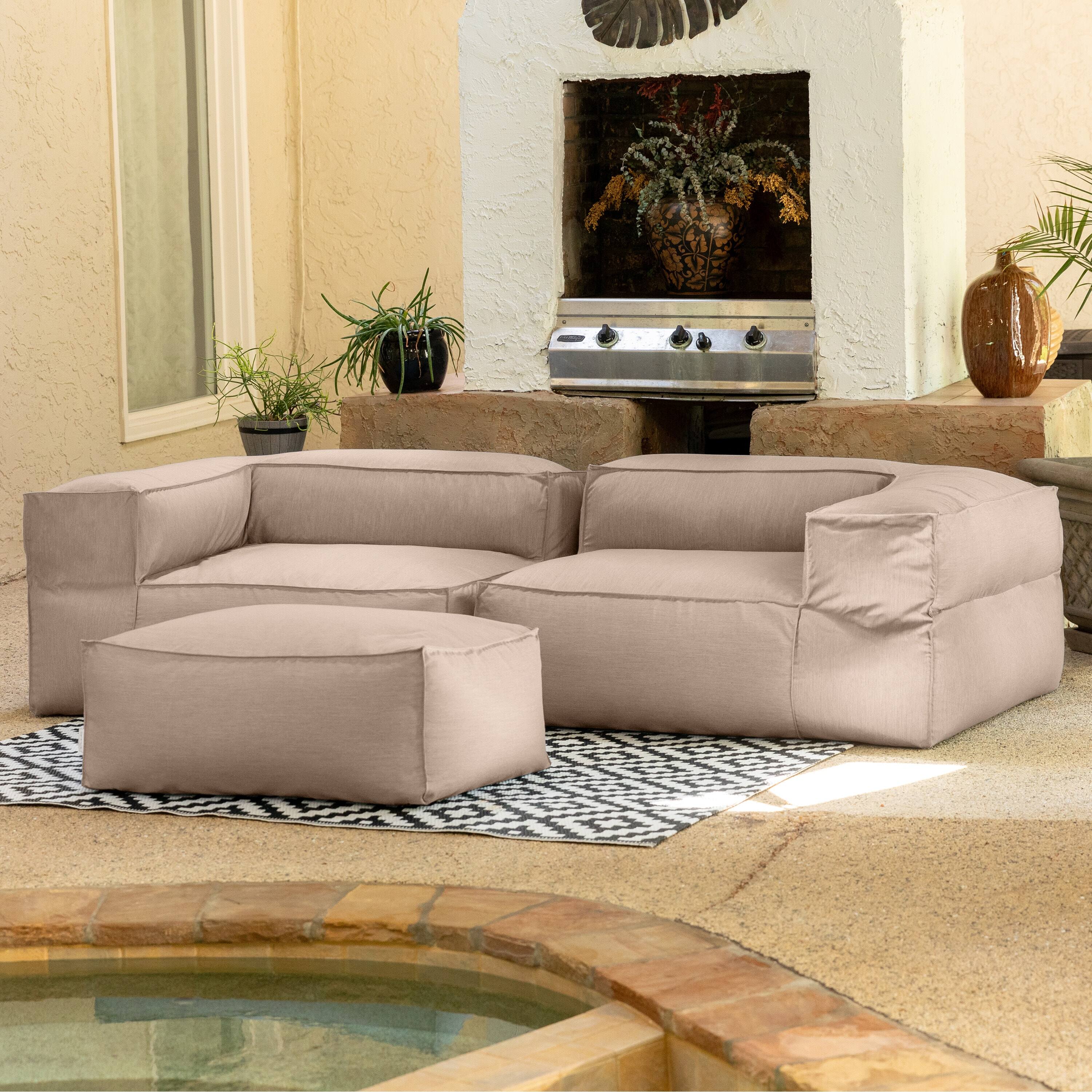 Left. Jaxx - Baya Outdoor Ottoman - Sunbrella, Petal - Petal.