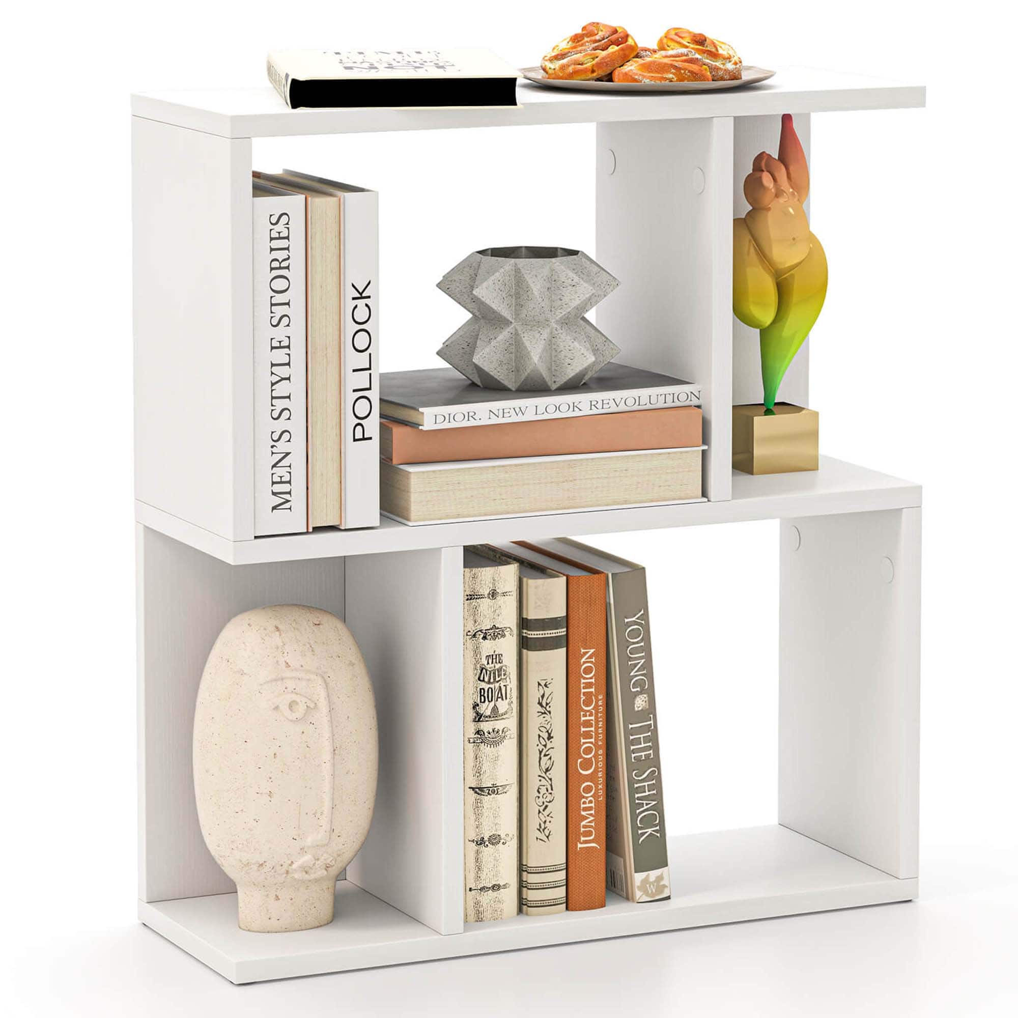 The image features a white bookshelf with various books and decorative items. There are several books on the shelf, including a book titled "Men's Pollock". Additionally, there is a vase and a sculpture on the shelf, adding to the decorative elements. The bookshelf also has a plate with food items on it, making it a multi-purpose display.