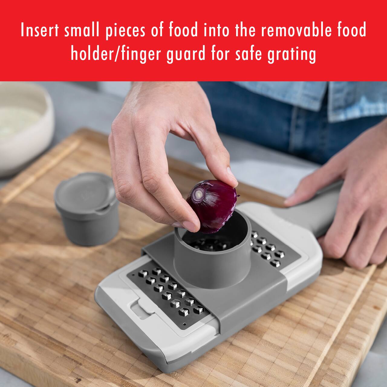 Insert small pieces of food into the removable food holder/finger guard for safe grating