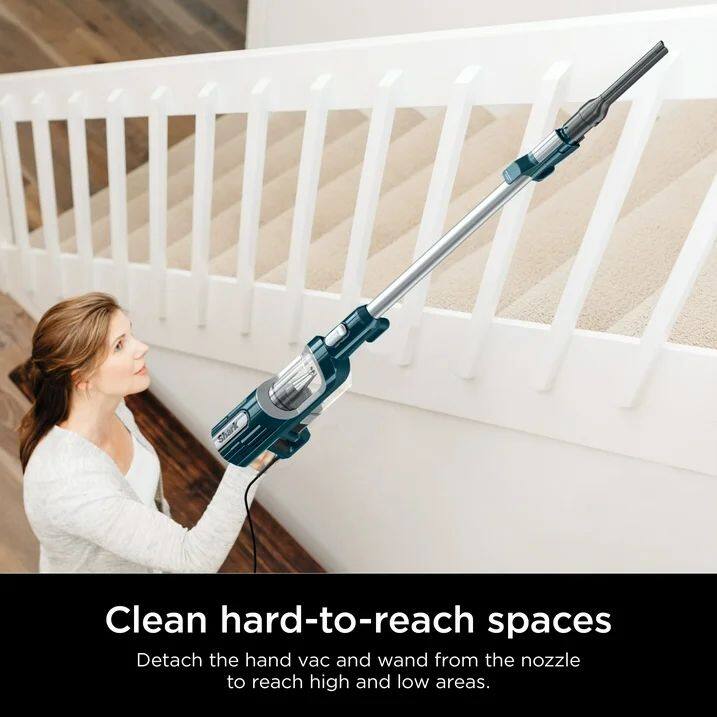 Clean hard-to-reach spaces  
Detach the hand vac and wand from the nozzle to reach high and low areas.