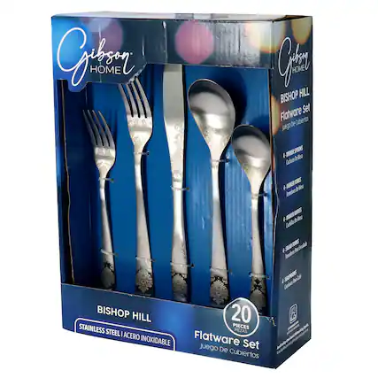 The image features a Bishop Hill flatware set, which includes a fork, spoon, and knife. The set is made of stainless steel and has a total of 20 pieces. The flatware set is displayed in a box, which is blue in color.
