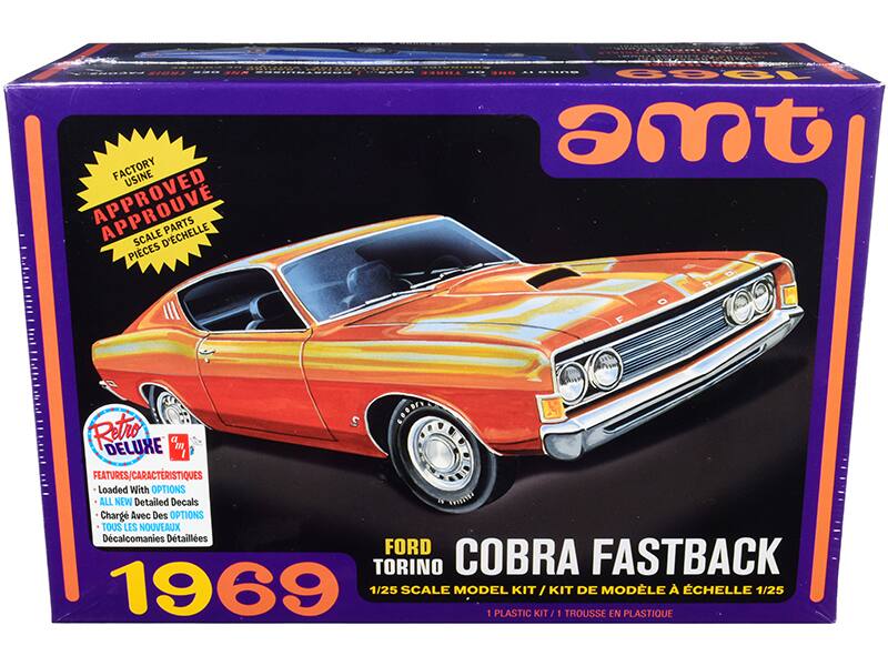 Sure, here is the corrected and grouped text from the image:

---

**Top Left Corner:**
- FACTORY USINE APPROVED SCALE PIECES D'ÉCHELLE

**Top Right Corner:**
- AMT

**Main Title:**
- FORD TORINO COBRA FASTBACK 1969

**Scale Information:**
- 1/25 SCALE MODEL KIT / KIT DE MODÈLE À ÉCHELLE 1/25
- 1 PLASTIC KIT / 1 TROUSSE EN PLASTIQUE

**Features/Caractéristiques:**
- Loaded With OPTIONS
- ALL NEW Detailed Decals
- Chargé Avec Des OPTIONS
- TOUS LES NOUVEAUX Décals Détails

**Retro Deluxe:**
- Retro DELUXE

**Bottom Left Corner:**
- 1969

**Bottom Right Corner:**
- AMT

---