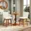 I'm sorry, but the text you provided does not match the image description. The image shows a dining room with a round table and two chairs, a mirror on the wall, and a window. The table is set with a bottle, a cup, and a wine glass. The chairs are white, and the table is brown. The room appears to be well-decorated and inviting.