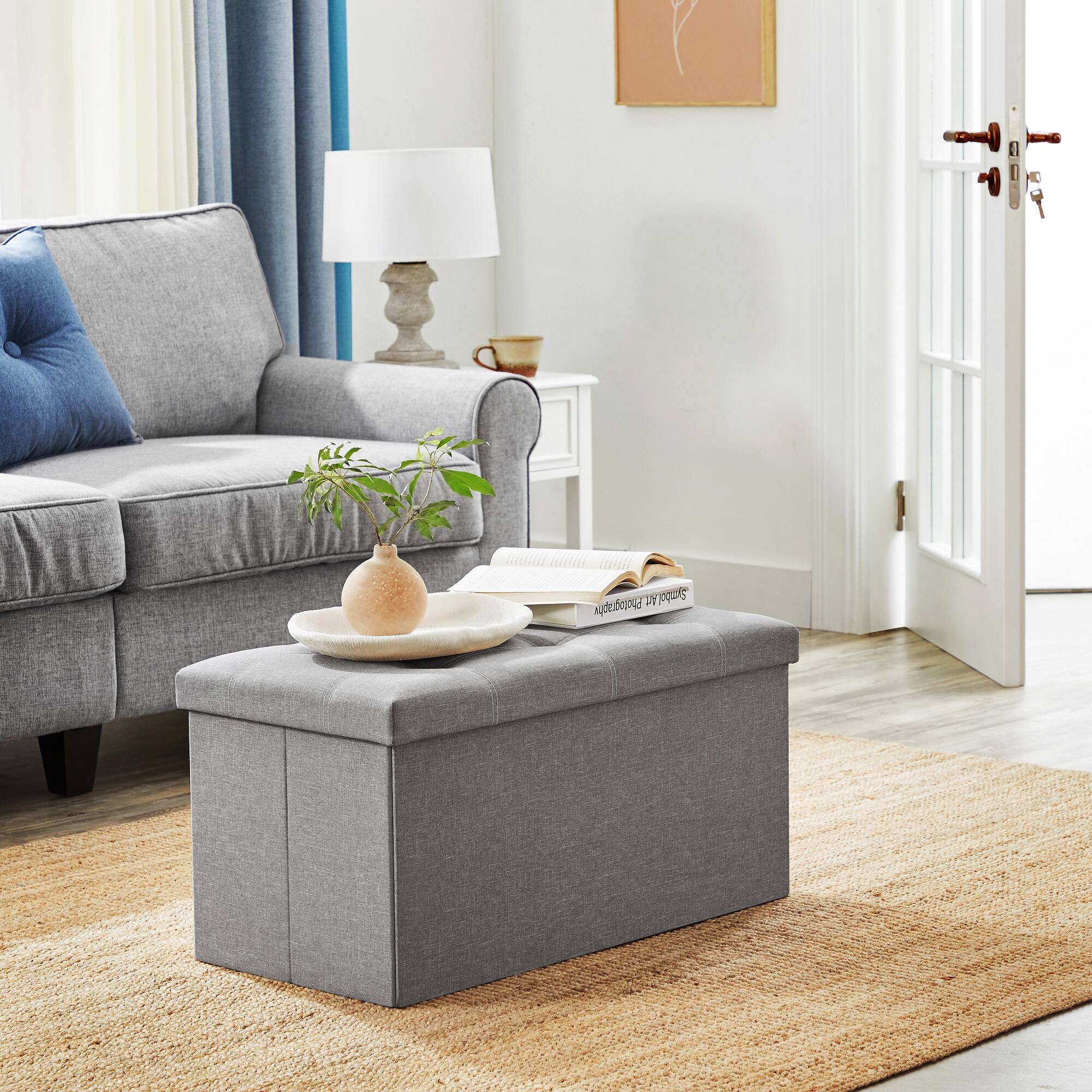 Angle. Songmics Home - Ottoman Storage Bench, 21 Gal. Folding Chest with Breathable Linen-Look Fabric, Holds 660 lb - Light Gray.