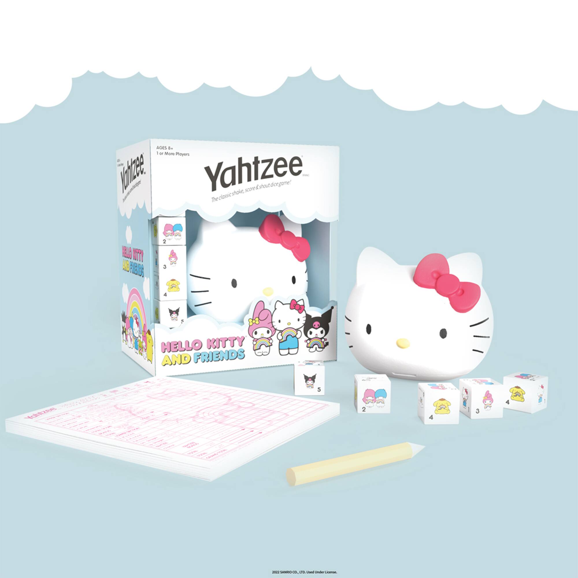 A box of Hello Kitty and Friends Yahtzee game is displayed on a table. The box contains a game board, a pencil, and a set of six Hello Kitty dice. The game is designed for players to roll the dice and score points by completing various tasks on the game board. The box is white and features the Hello Kitty characters on the front. The game is intended for children and is a fun and engaging way to spend time with friends or family.