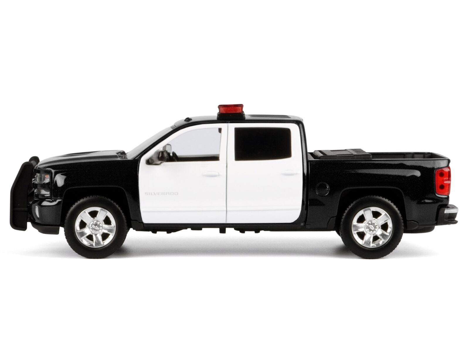 Alt View 3. Motormax - 2017 Chevrolet Silverado 1500 LT Z71 Crew Cab Truck Black and White with Lights and Sounds 1/27 Model Car by Motormax.
