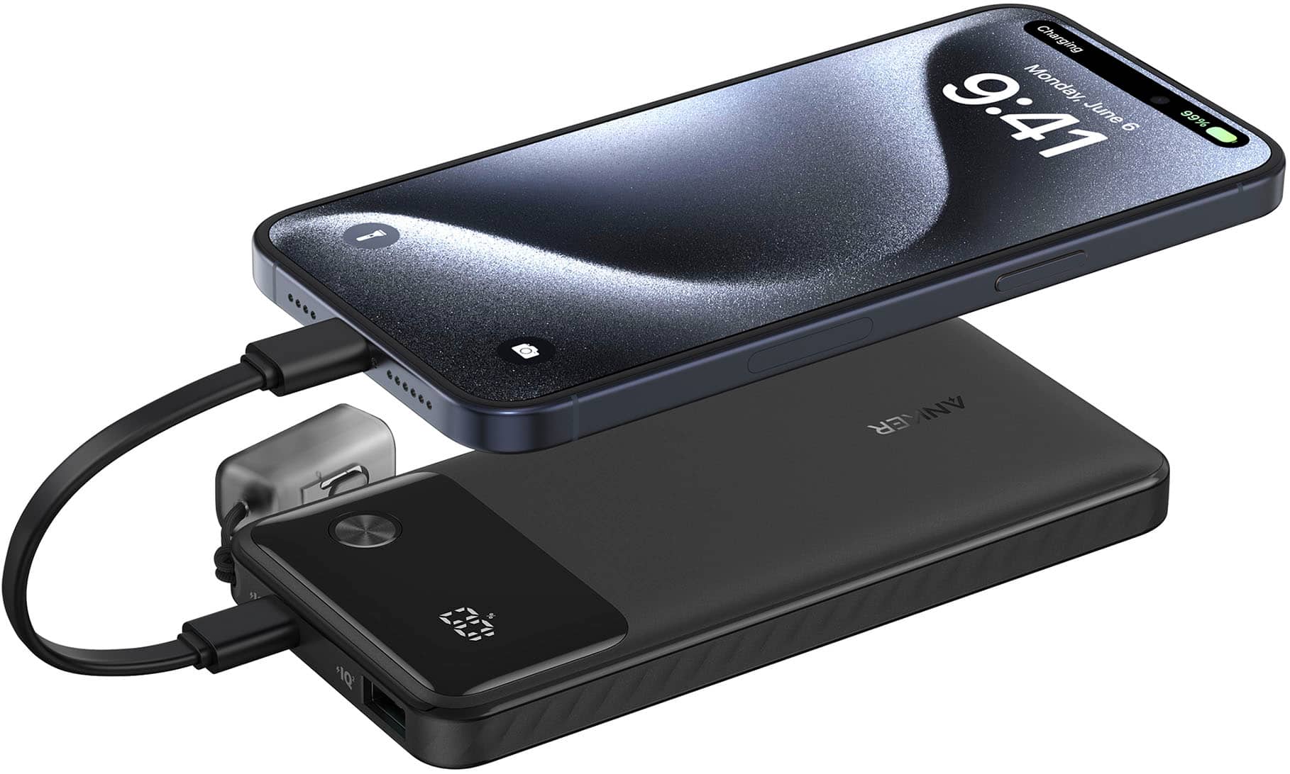 The image shows a cell phone that is being charged. The phone is connected to a charger, and the charger is plugged into a wall outlet. The phone is positioned on top of the charger, and the charger is sitting on a table. The cell phone is an LG phone, and the charger is an Anker charger. The image was taken on June 6, 2019.