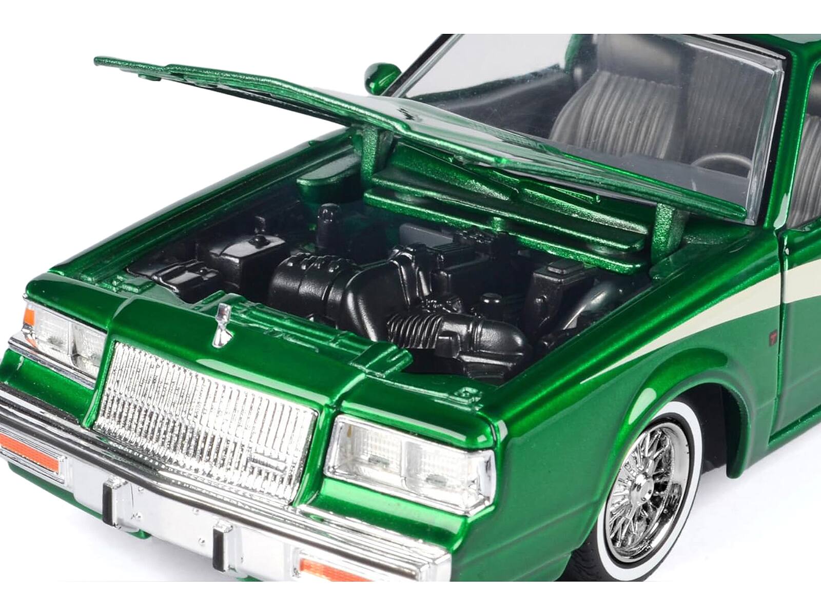 Alt View 2. Motormax - 1987 Buick Regal 3.8 SFI Turbo Green Metallic and Cream with Graphics "Get Low" Series 1/24 Model Car by Motormax.