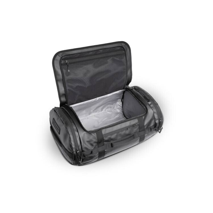 Angle. WANDRD - WANDRD CARRYALL Duffel Backpack with Expandable Bottom Compartment (Black, 60L) - Black.