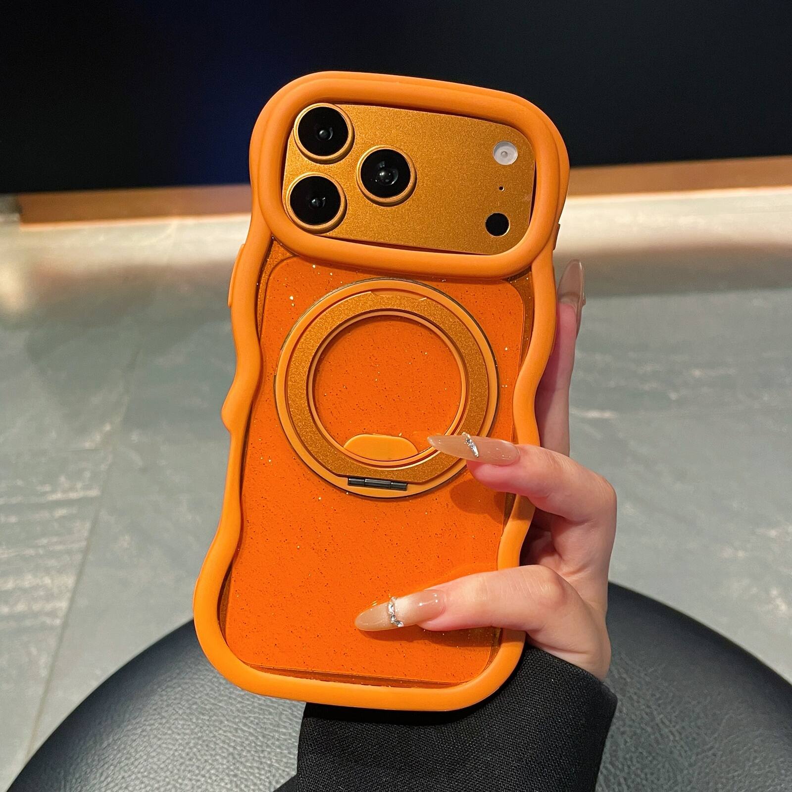 Angle. Dteck - for Apple iPhone 17 Pro Max Wave-Frame Glitter Clear Case,Rugged Shock-absorbent Cover with Metal Rotation Kickstand - Orange.