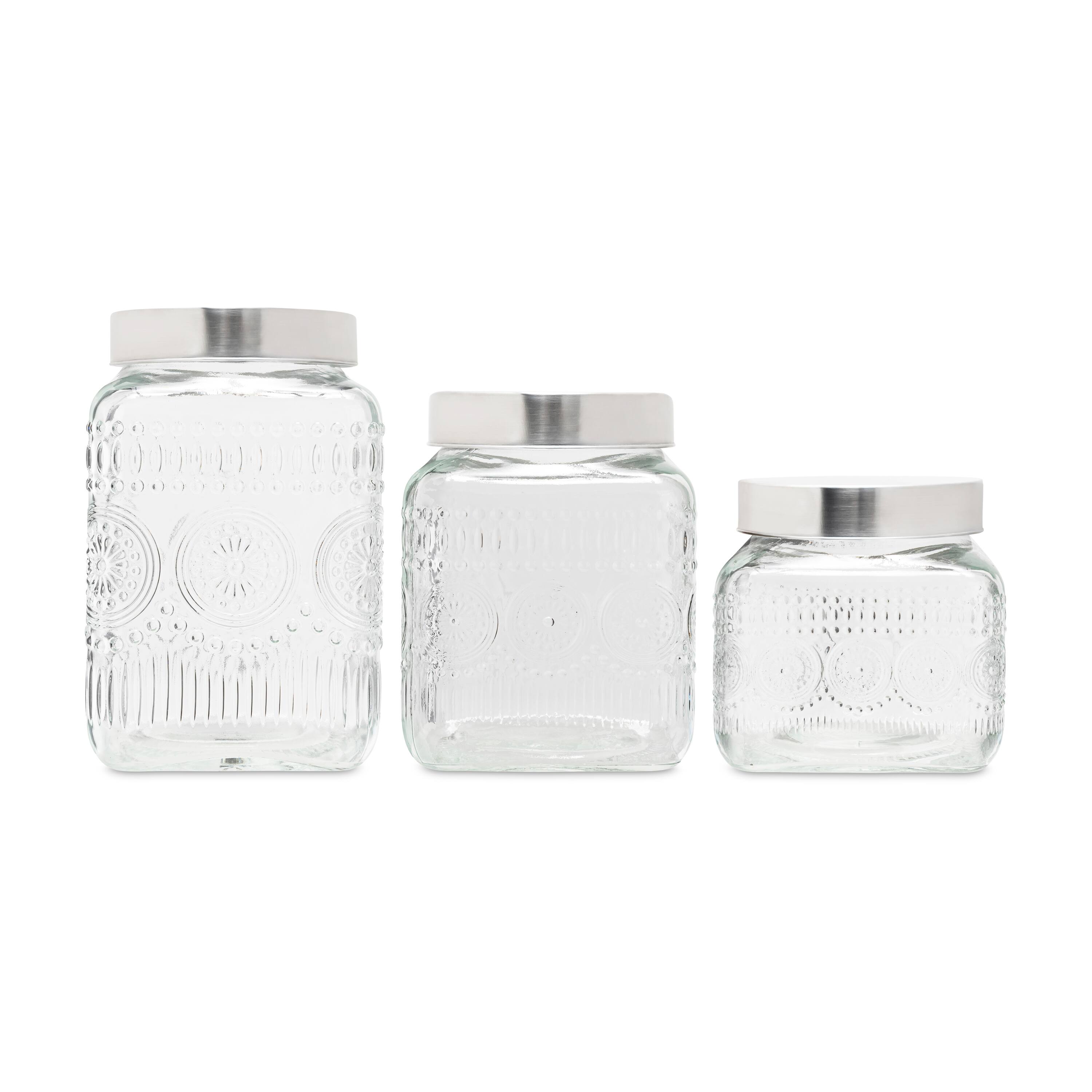 Angle. Style Setter - Medallion Embossed Set of 3 Glass Canister with Silver Lid.