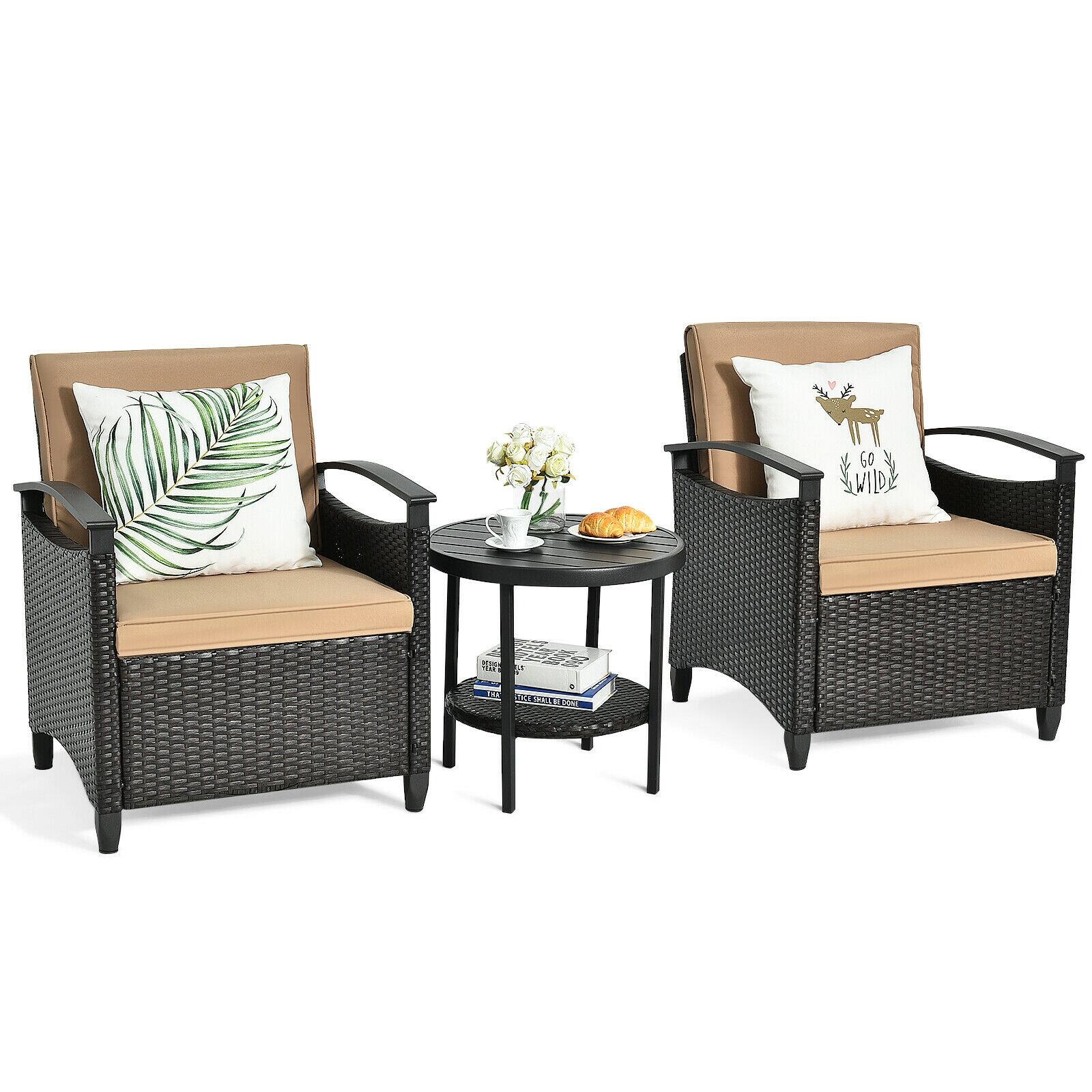 The image features two wicker chairs with matching pillows, placed around a small table. The table is adorned with a vase of flowers, adding a touch of elegance to the scene. The chairs are positioned in such a way that they face each other, creating a cozy and inviting atmosphere. The combination of the chairs, table, and flowers creates a comfortable and visually appealing outdoor setting.
