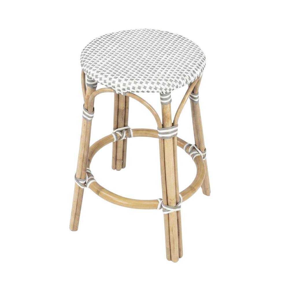 Angle. Butler Specialty - Tobias Rattan Round 24" Counter Stool - White And Gray Dot.