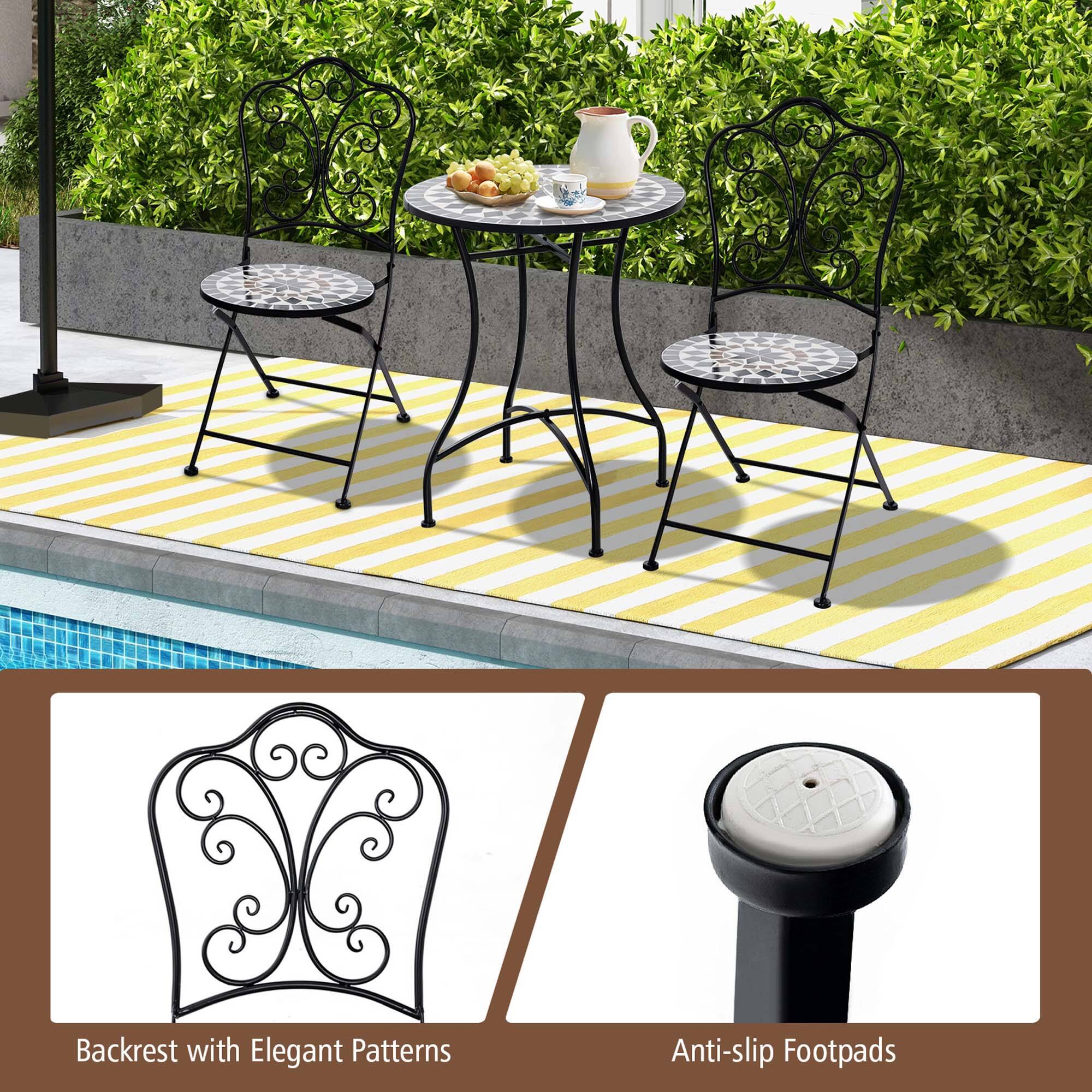 The image features a patio set with a table and four chairs. The table is accompanied by a backrest with elegant patterns and anti-slip footpads, providing comfort and safety for the users. The chairs are arranged around the table, creating a cozy and inviting outdoor seating area.