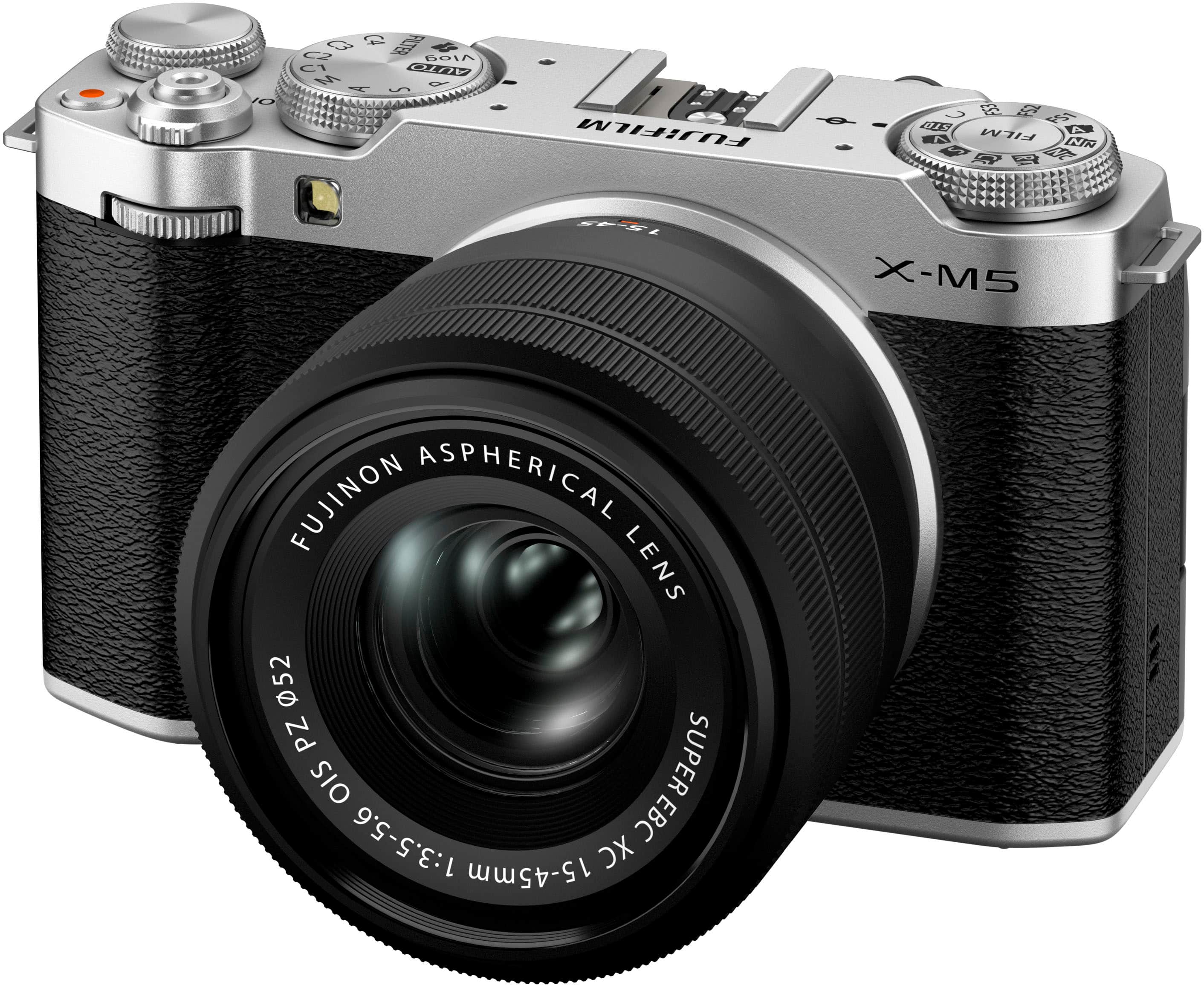 The image features a Fujifilm X-M5 camera with a Fujinon aspherical lens. The lens is a 52mm super OIS lens with a focal length of 1:3.5-5.6. The camera is equipped with an electronic viewfinder and has a 15-45mm zoom range.