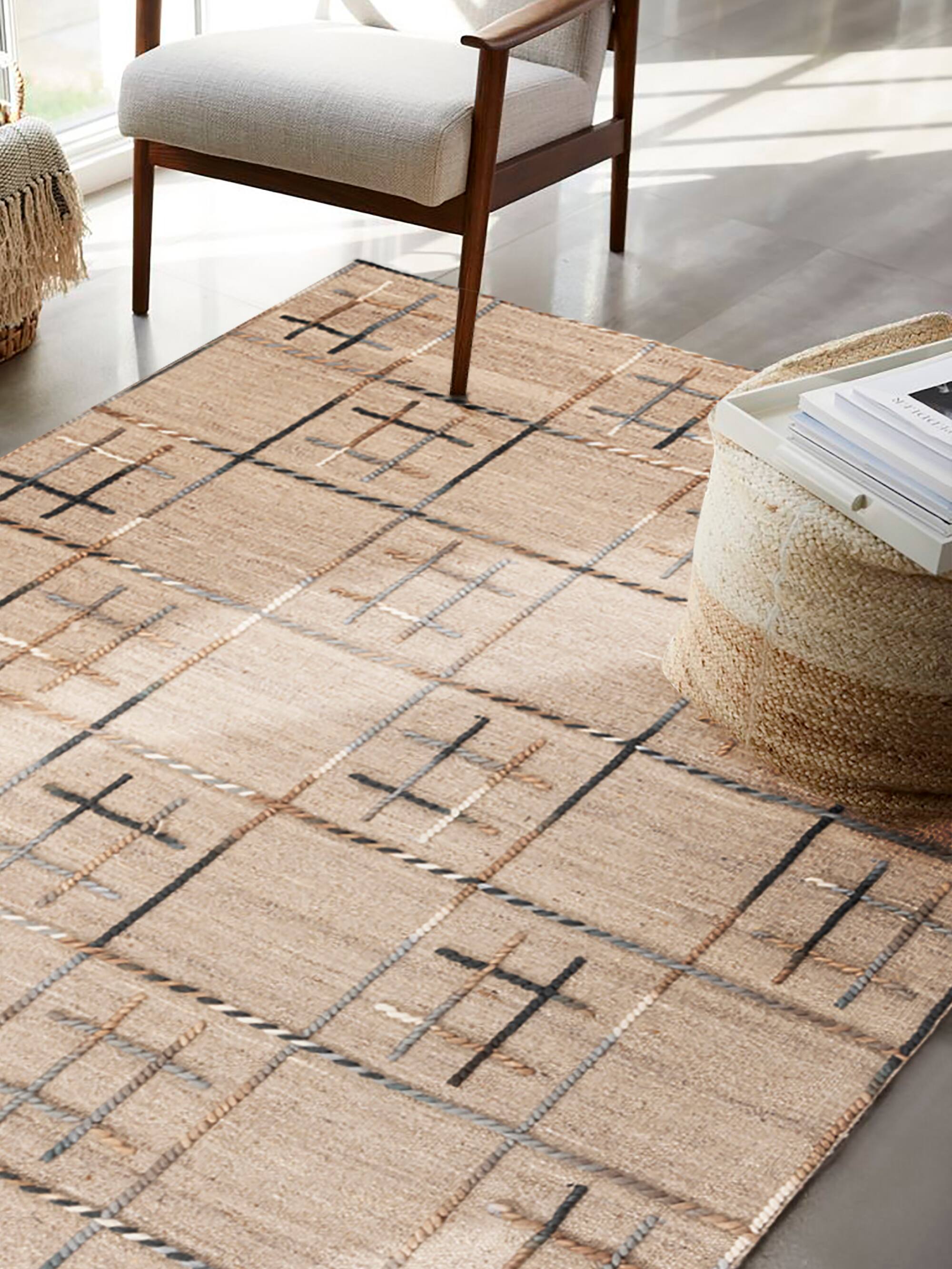 Left. GAURI KOHLI - Gilbert Rug - Shades of brown and gray.