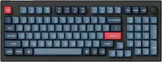 The image shows a blue and black keyboard with a red dot on the F key. The keys are labeled with numbers and symbols, including the numbers 1 through 9, the symbols +, -, and =, and the letters Q, W, E, R, T, Y, U, I, O, P, J, K, L, and Z. The keyboard also has a red dot on the F key, which is likely a function key. The layout of the keyboard suggests that it is designed for a computer or other device that requires a numeric or symbol-based input system.