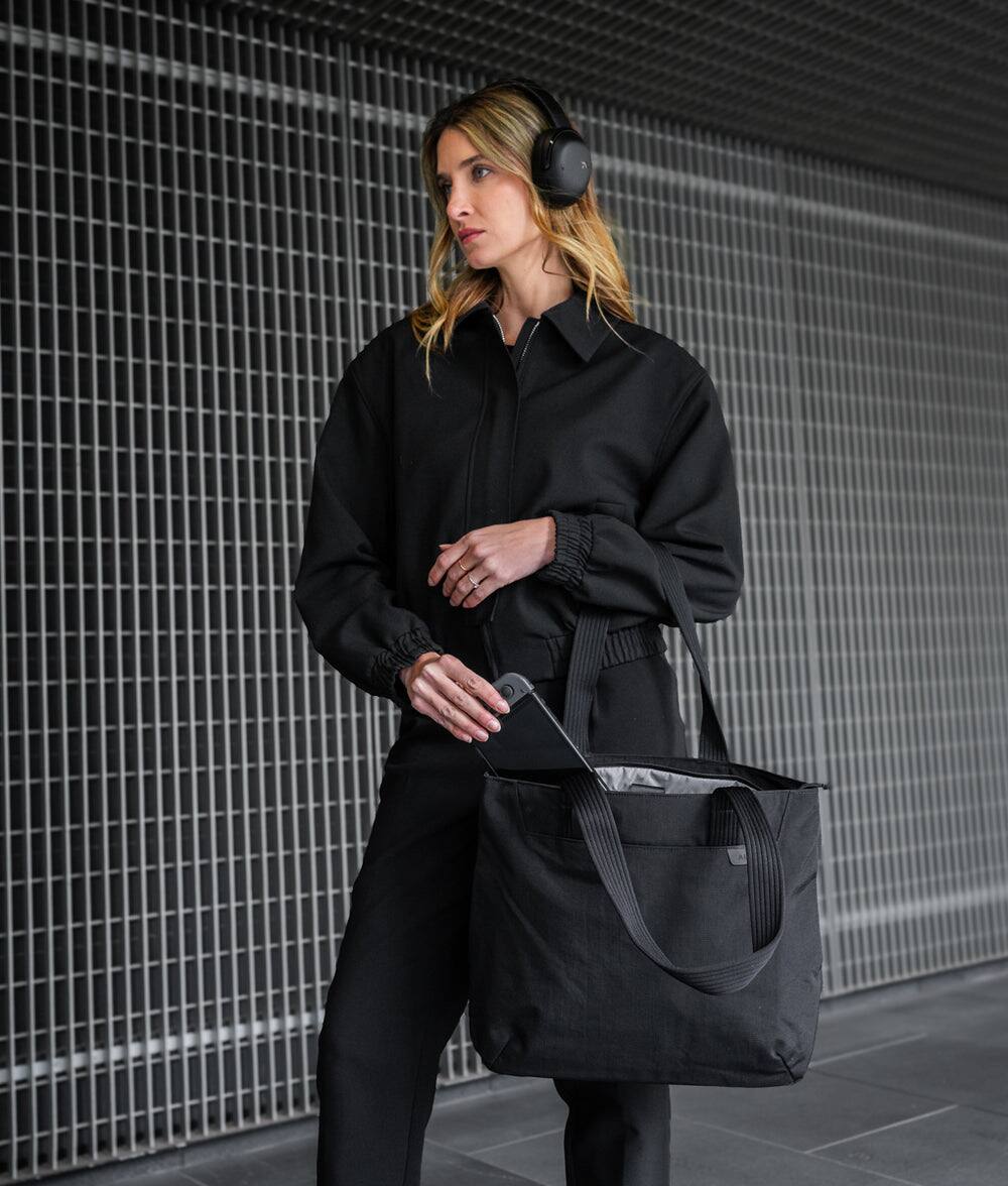 Alt View 7. ALPAKA - Flight Tote (L) Laptop Tote Bag for Work, Large Tote Bag Fits 16" MacBook Pro, Water Bottle Pocket, Luggage Pass-Through - Black Axoflux 400D.