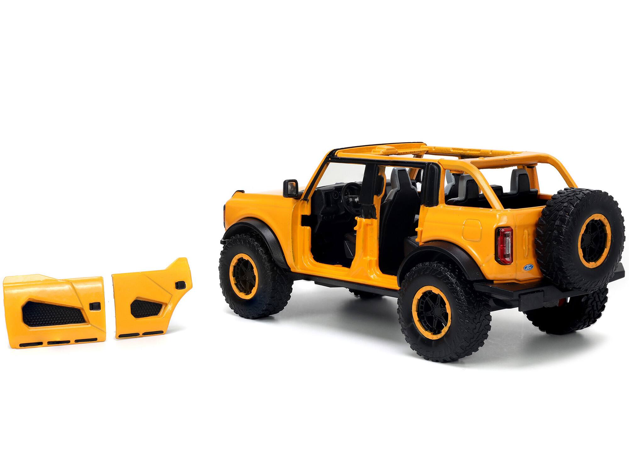 Alt View 2. Jada - 2021 Ford Bronco Orange Metallic with Extra Wheels "Just Trucks" Series 1/24 Diecast Model Car by Jada.
