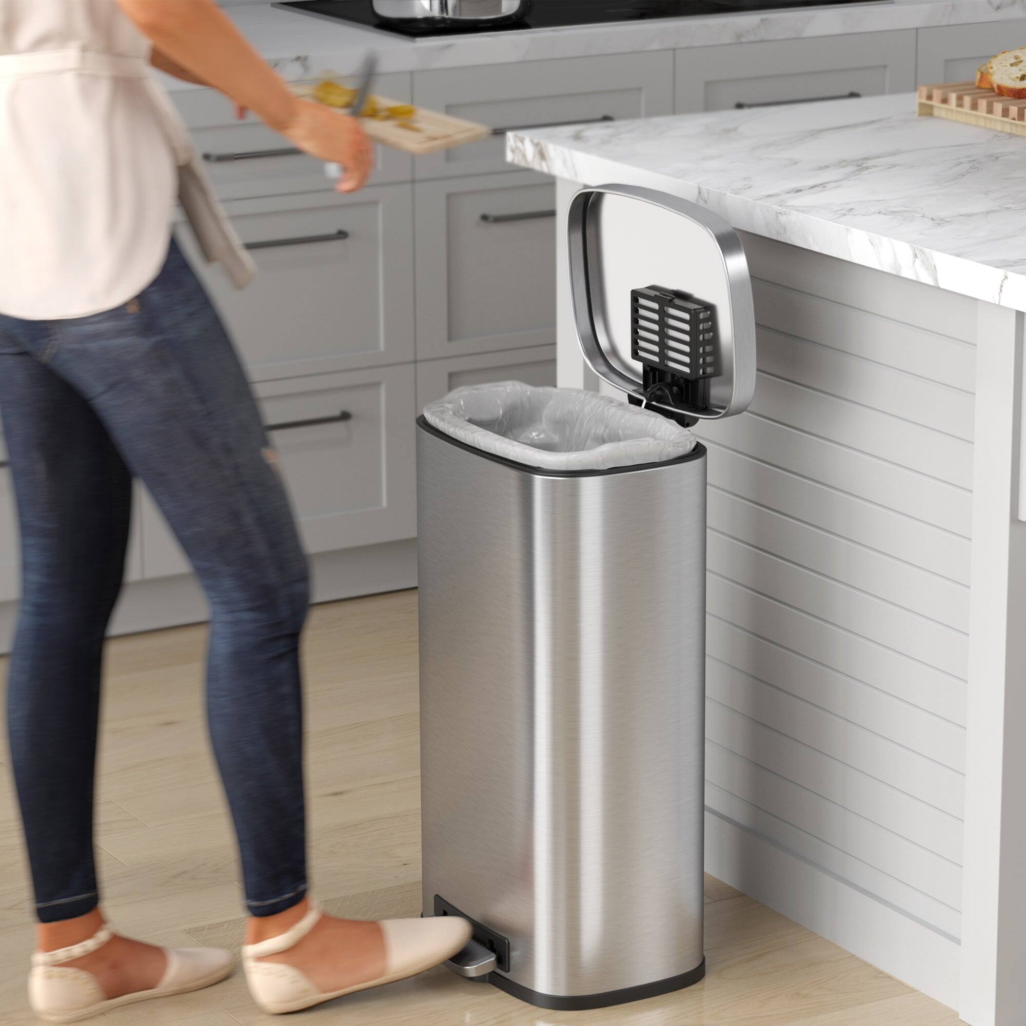 Angle. iTouchless - 8 Gallon SoftStep Stainless Steel Step Kitchen Trash Can with AbsorbX Odor Filter - Silver.