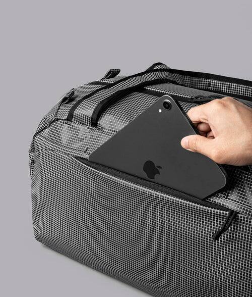 Alt View 7. ALPAKA - 35L Lightweight Duffel Bag for Gym, Weekend Trips & Carry-On Travel, Momentum Duffel, Weather-Resistant - Axodyne hybrid Grey.