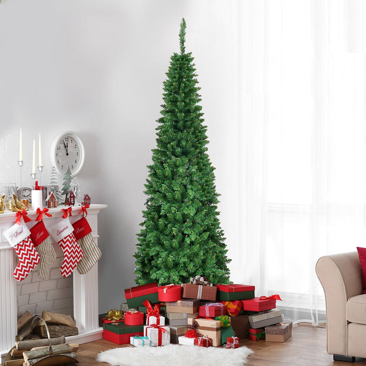 The image shows a Christmas tree in a living room with a fireplace. The tree is surrounded by presents, and there are stockings hanging nearby. The room also features a clock and a chair. The text on the image reads "1 12 1 1 2 3 1 : : 4 Dad Mm Emma Seo."