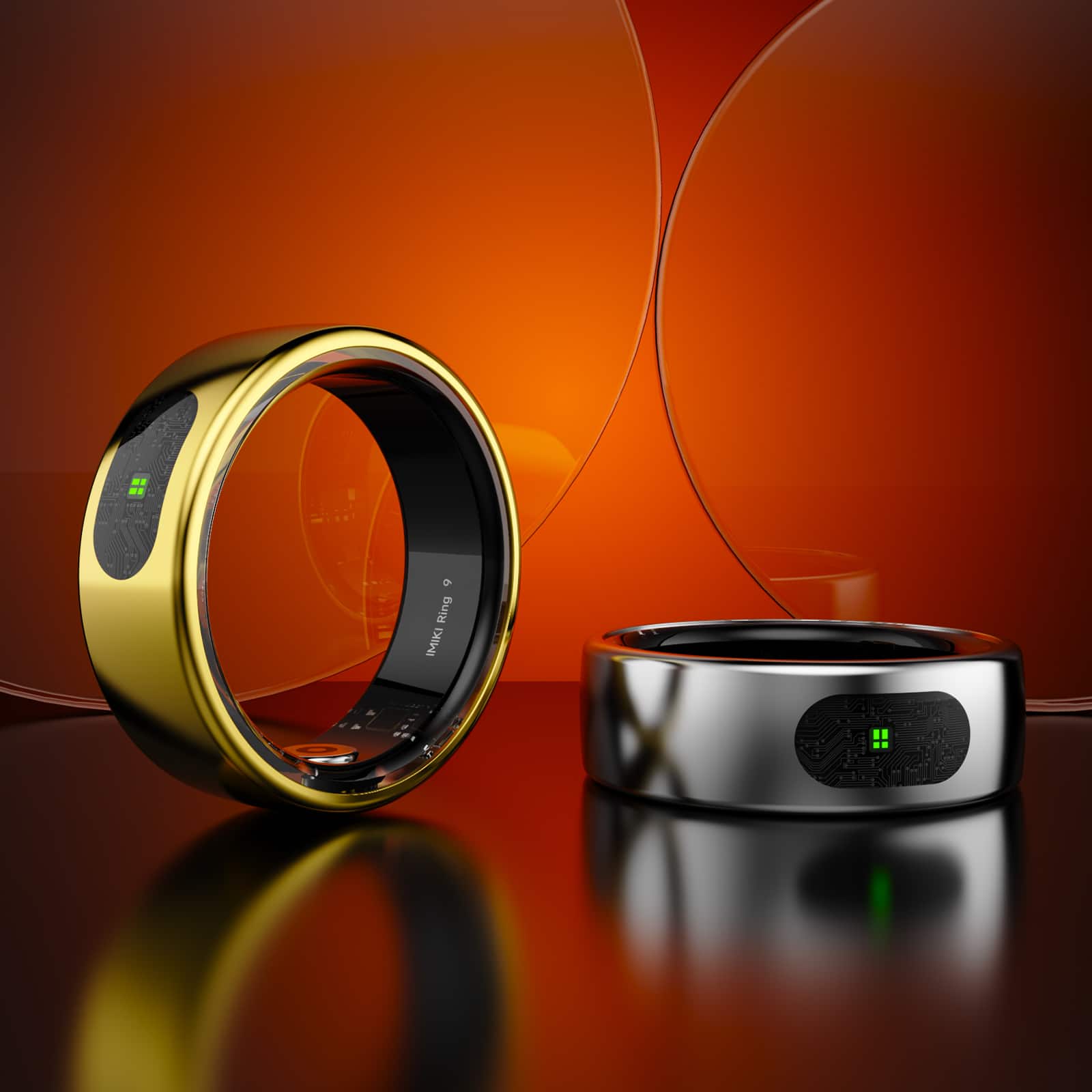 The image features a gold ring and a silver ring, both of which are imikis. The gold ring is placed on a table, while the silver ring is sitting next to it. The rings are displayed in front of an orange background, which adds a vibrant touch to the scene.