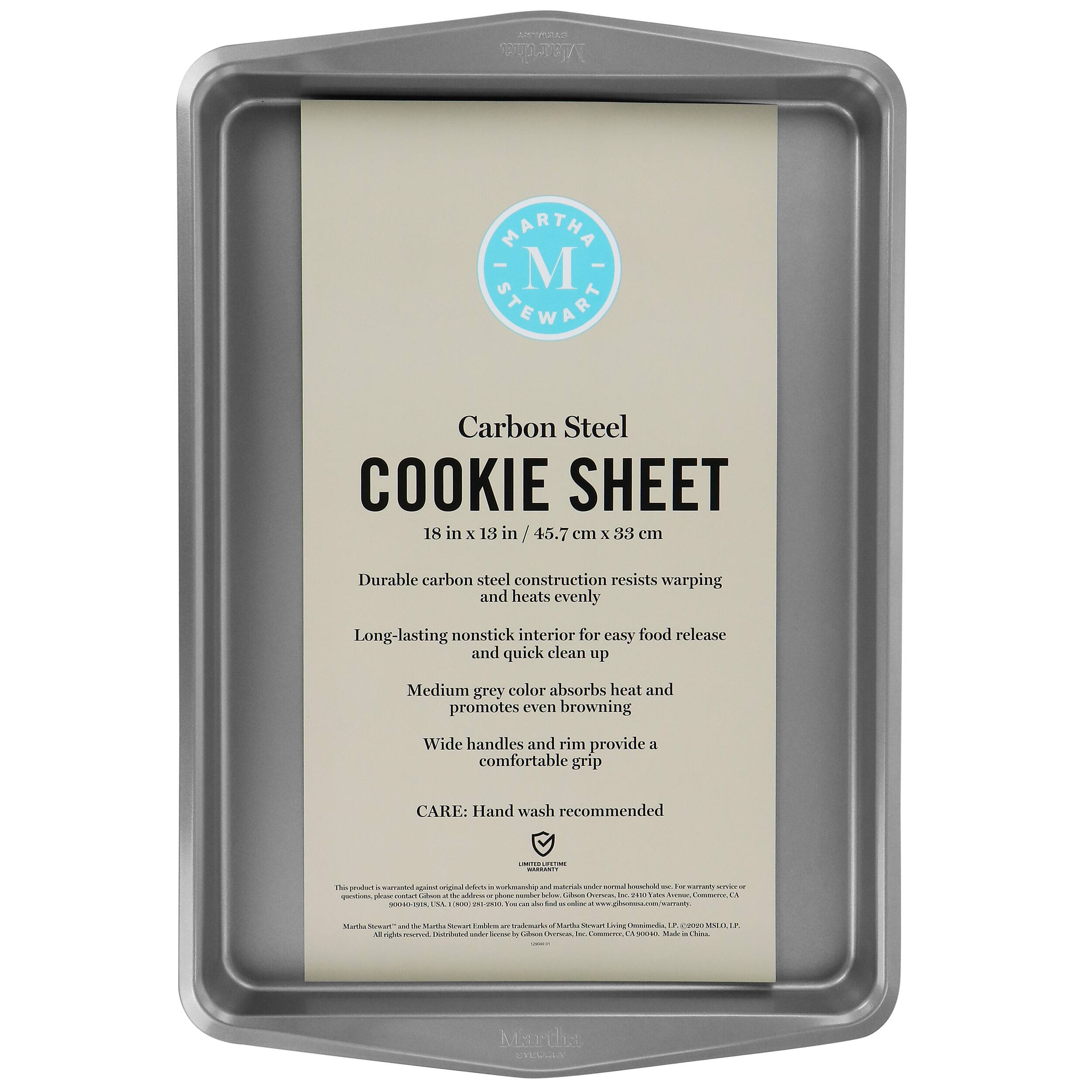 A Martha Stewart Carbon Steel Cookie Sheet is a durable and long-lasting option for baking cookies. The carbon steel construction resists warping and heats evenly, ensuring that your cookies turn out perfectly. The nonstick interior makes it easy to release your cookies and clean up quickly. The medium grey color absorbs heat and promotes even browning, while the wide handles and rim provide a comfortable grip. To maintain the cookie sheet, hand washing is recommended.