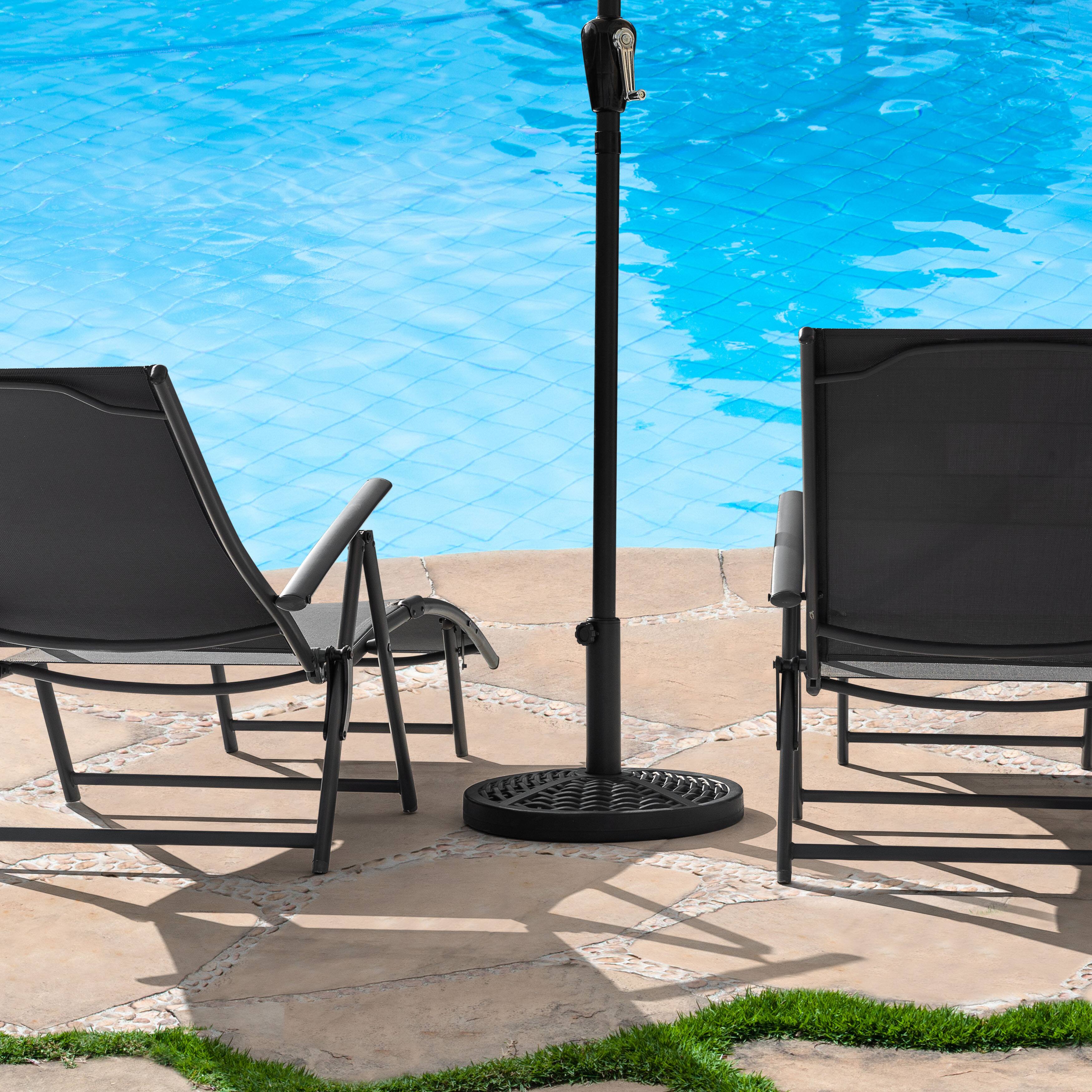 Angle. Nuu Garden - Outdoor 26 lb. Round Black Patio Umbrella Base, Polyethylene and Concrete - Black.